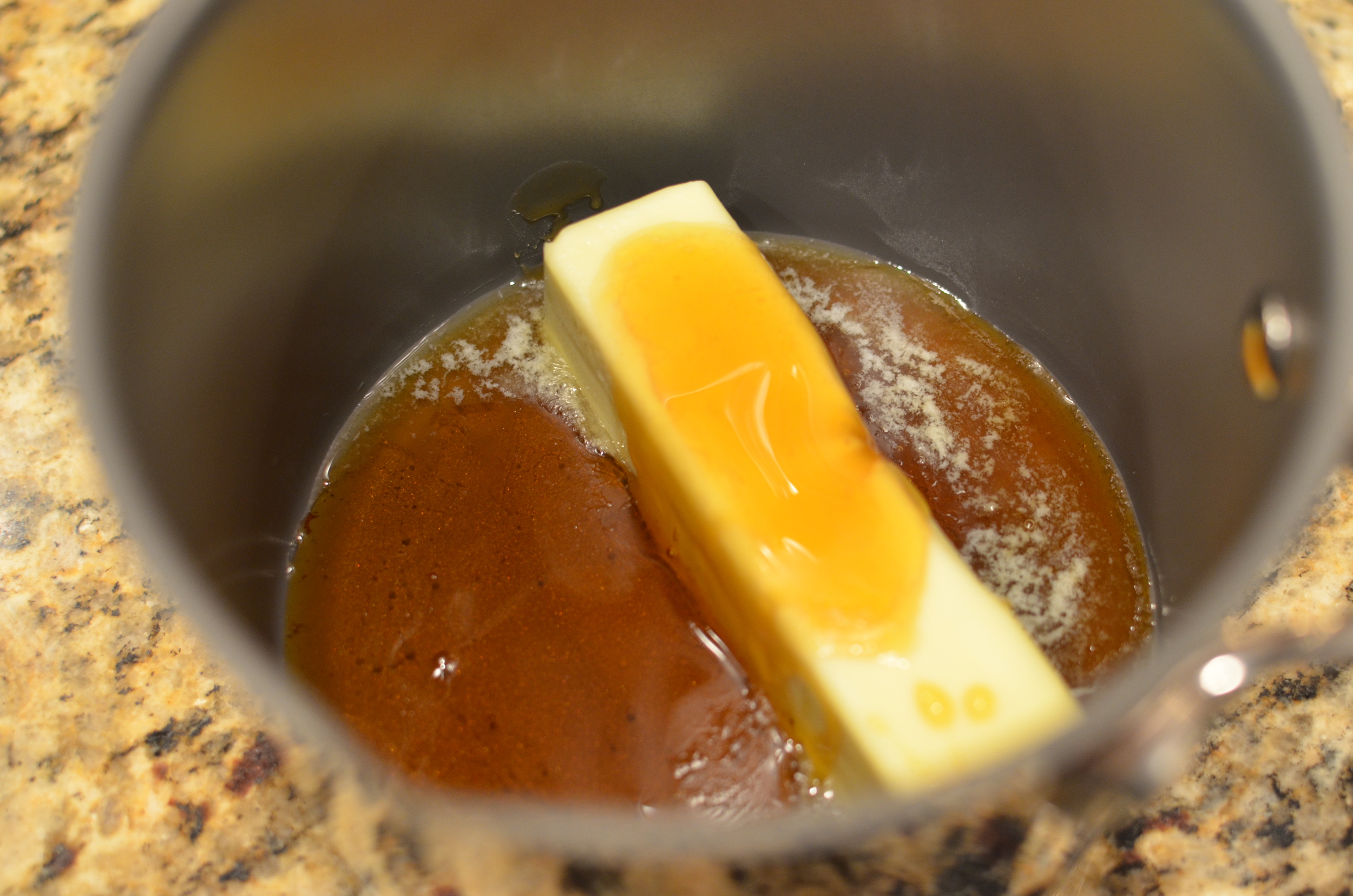 Combine the golden syrup with a stick of butter.
