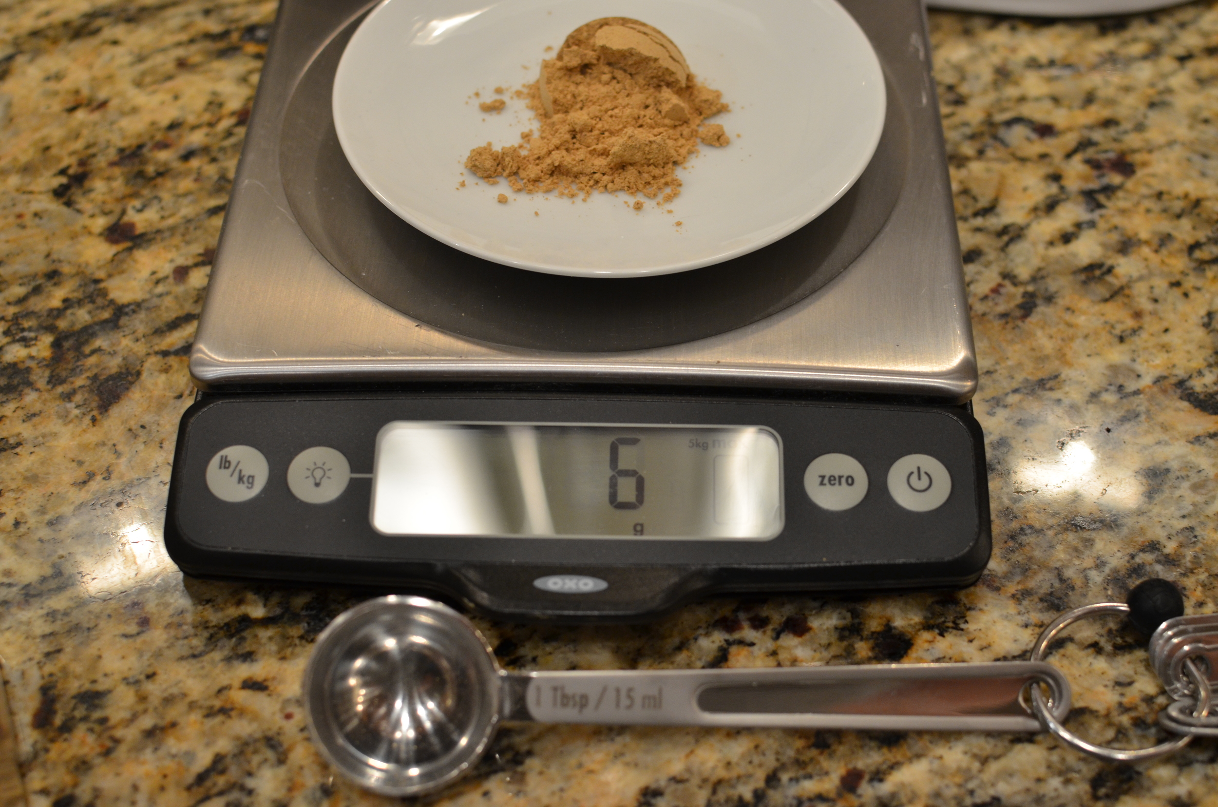 Weigh out 1 tablespoon of ground ginger, which should equal 6 grams (not 3 as the book states). Make a note in your book.