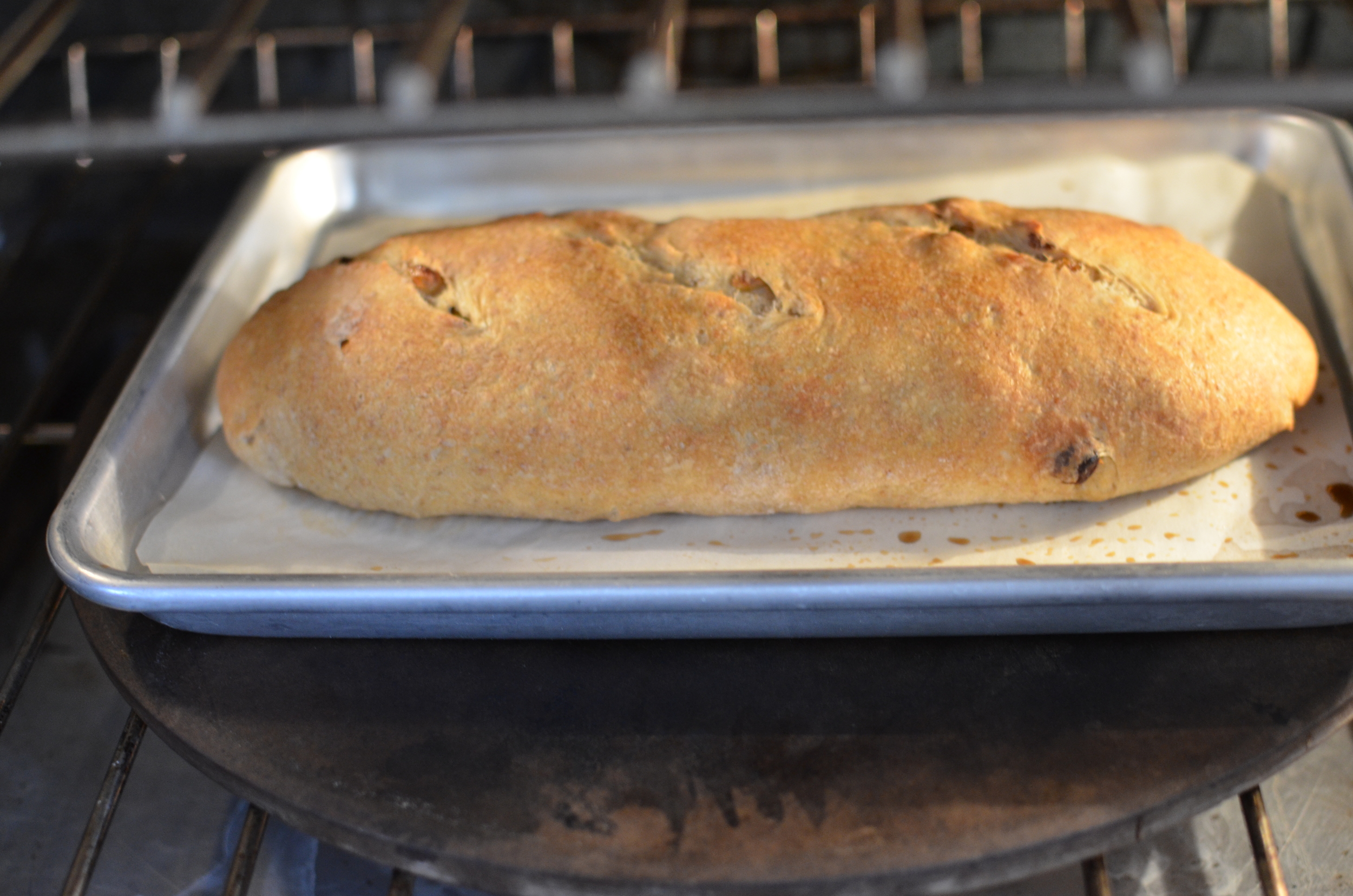 Then pop the loaf into the screaming hot oven, toss the ice cubes into the pan on the oven floor, and quickly close the oven door. Bake for 5 minutes, then lower the heat to 400F and continue baking for 30-40 minutes.