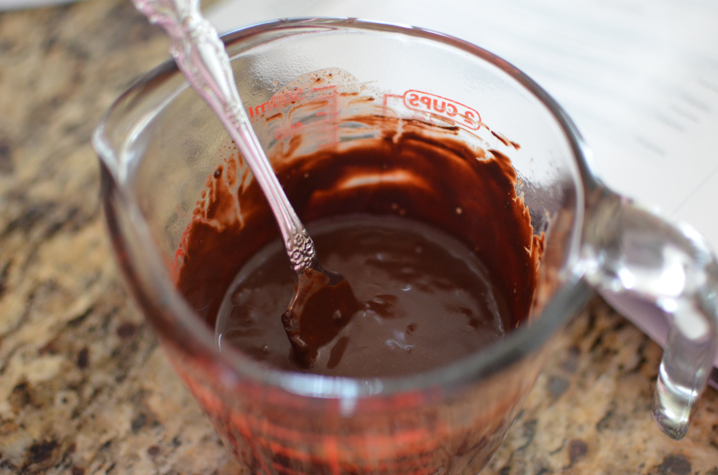 This is done by mixing Dutch processed cocoa powder with boiling water until smooth and allow it to cool. Be sure to cover the container with plastic wrap to prevent too much moisture from evaporating from the mixture. Set it aside until we need it again.