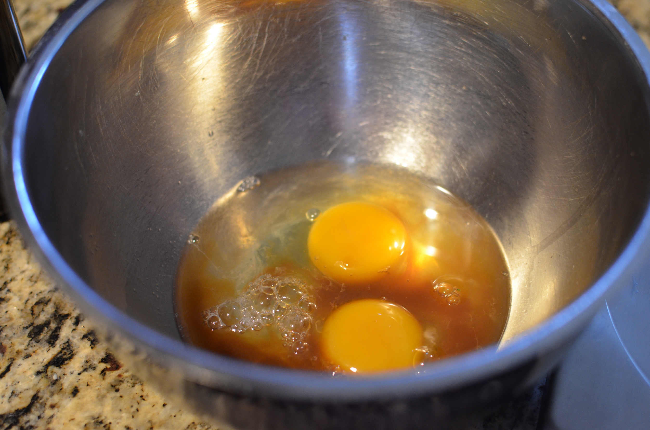 In a bowl, combine eggs, water, and pure vanilla extract. 