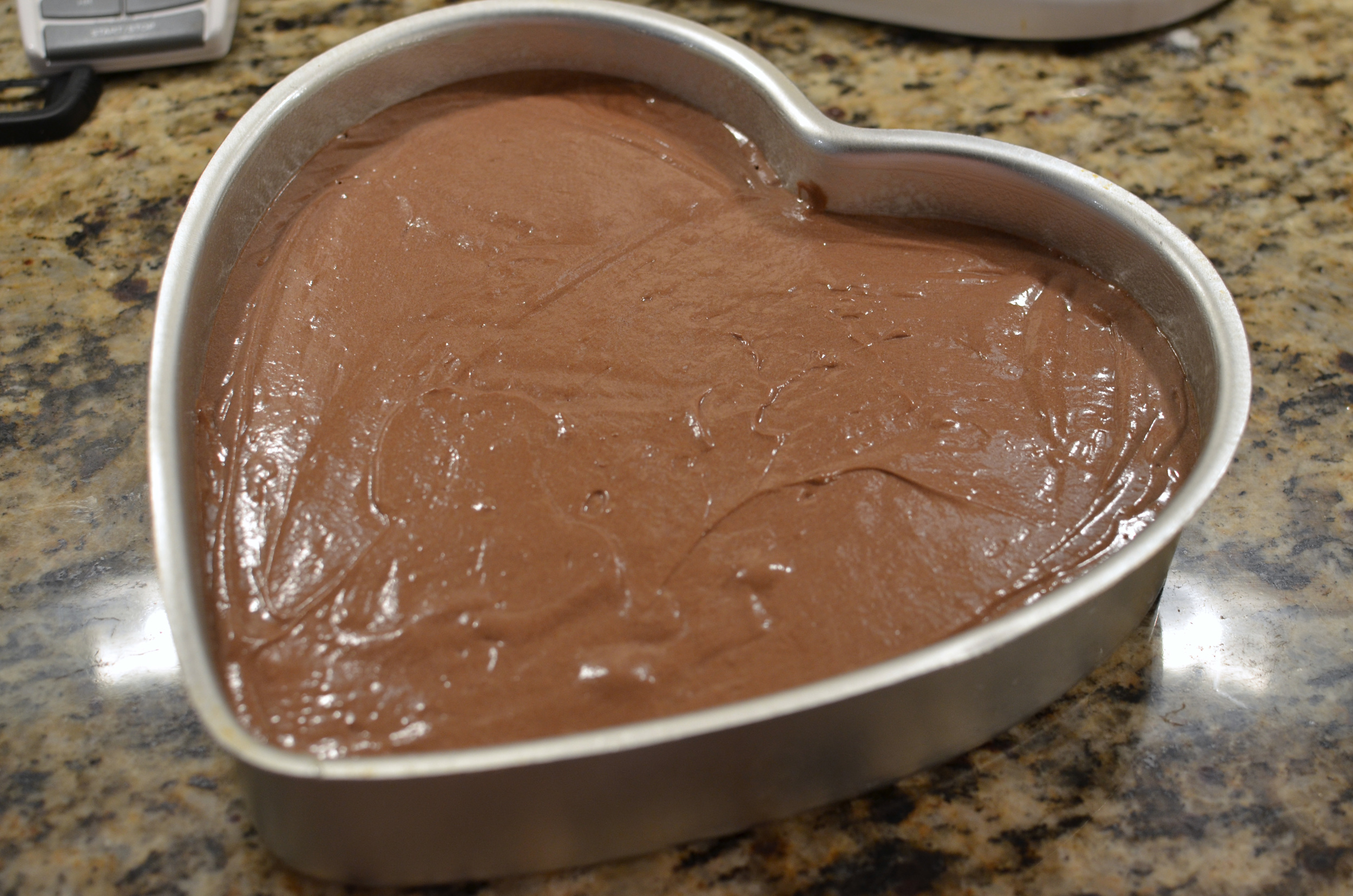 Pour the batter into a prepared cake pan. Since it was the week of Valentine's Day, I decided to bake my cake in this heart shaped pan . 