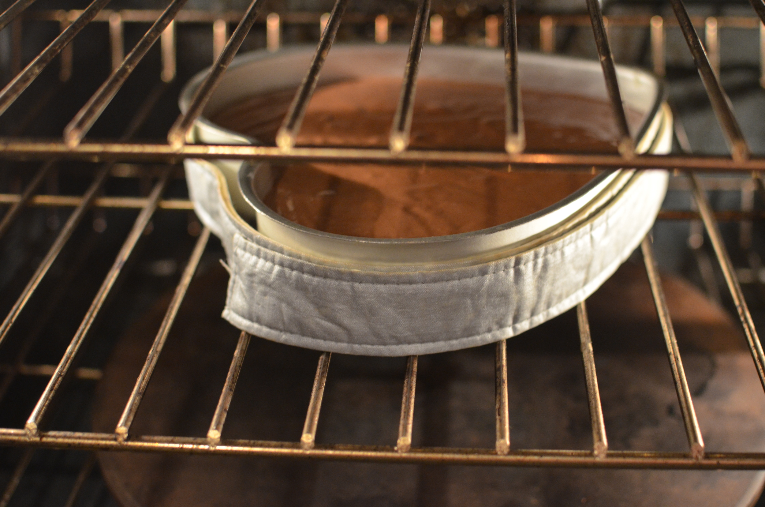 Don't forget to wrap the pan with insulated cake strips - they really eliminate a hump from forming as the cake bakes.