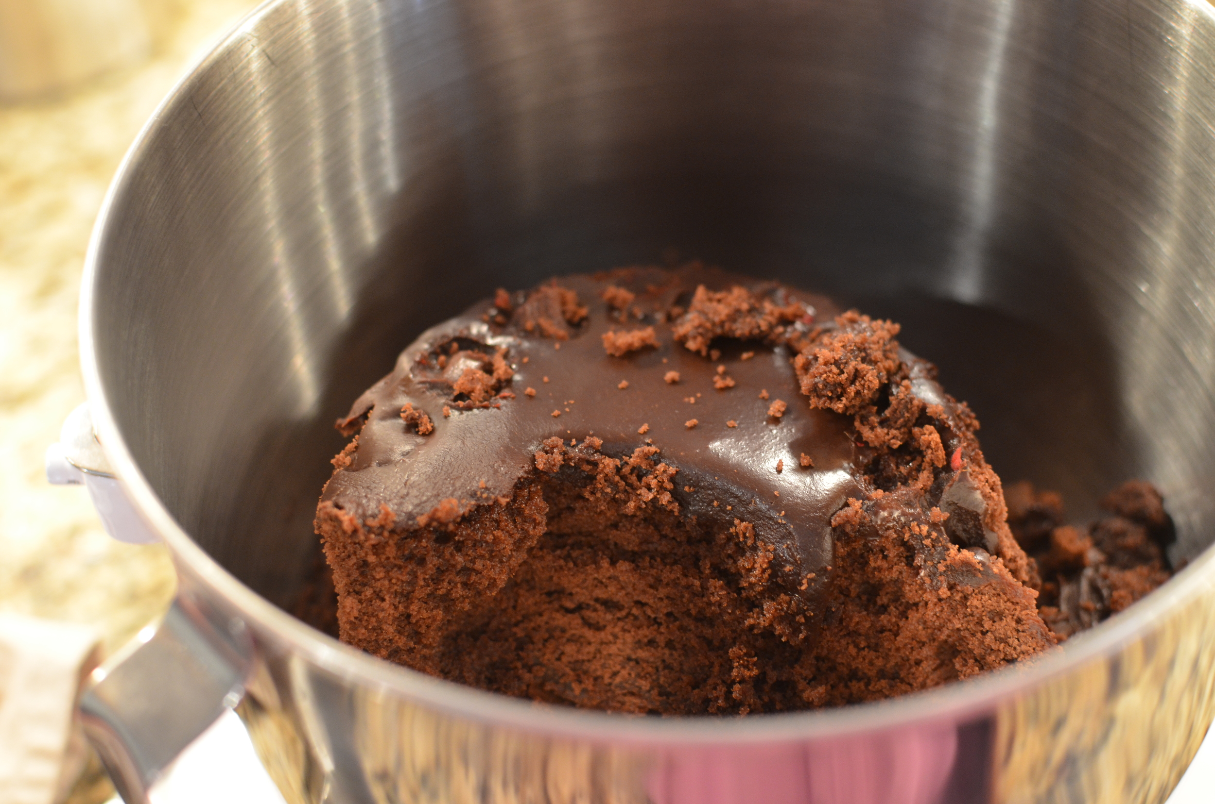 So I placed the leftover ganache covered cake into the bowl of my stand mixer with a splash of heavy cream and mixed it up. 