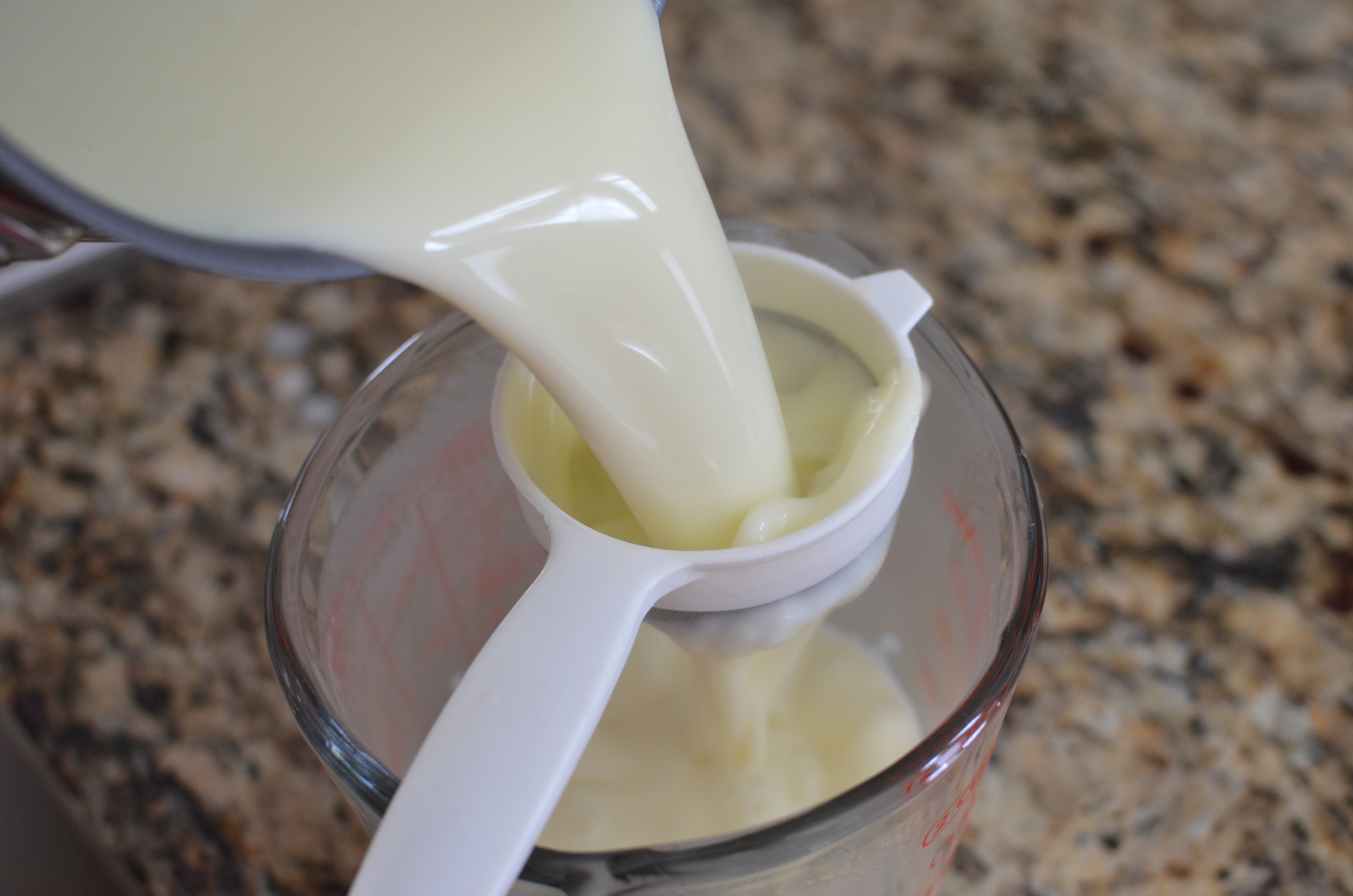 Strain the mixture through a fine mesh sieve . 