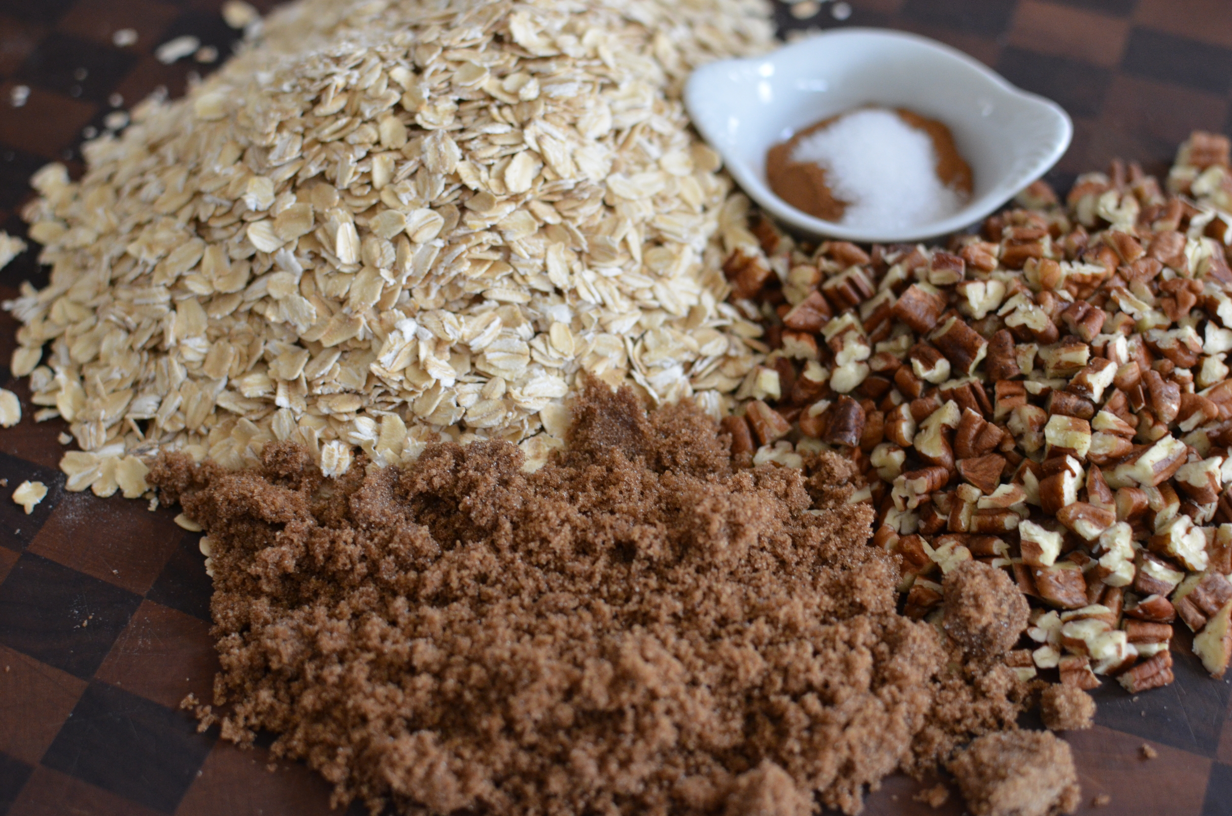 To begin with, we have to make the granola that goes into these cookies. Chopped nuts, rolled oats, brown sugar, cinnamon, and salt.