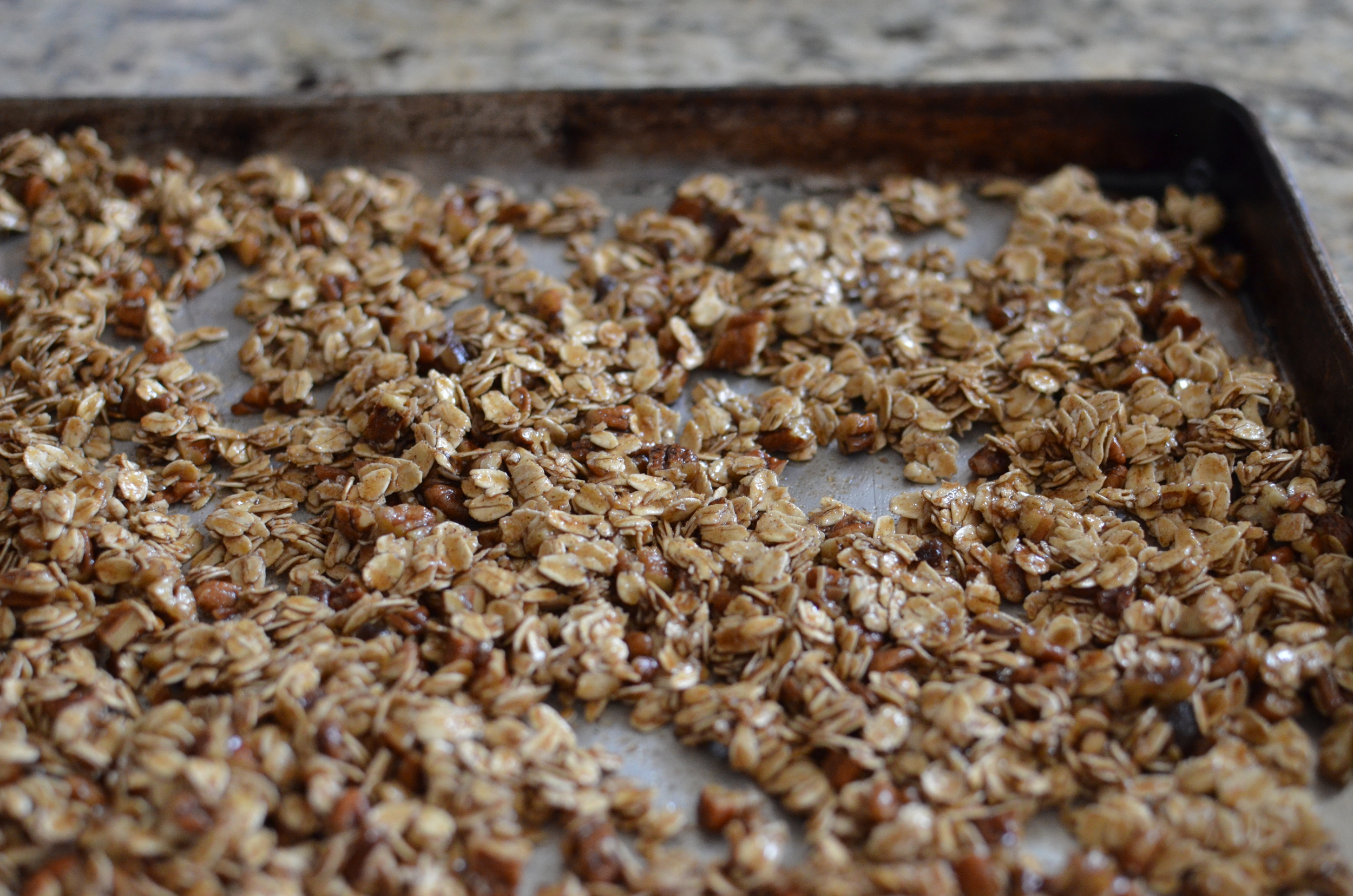 Pour the mixture onto a baking sheet and pop it in the oven to bake.