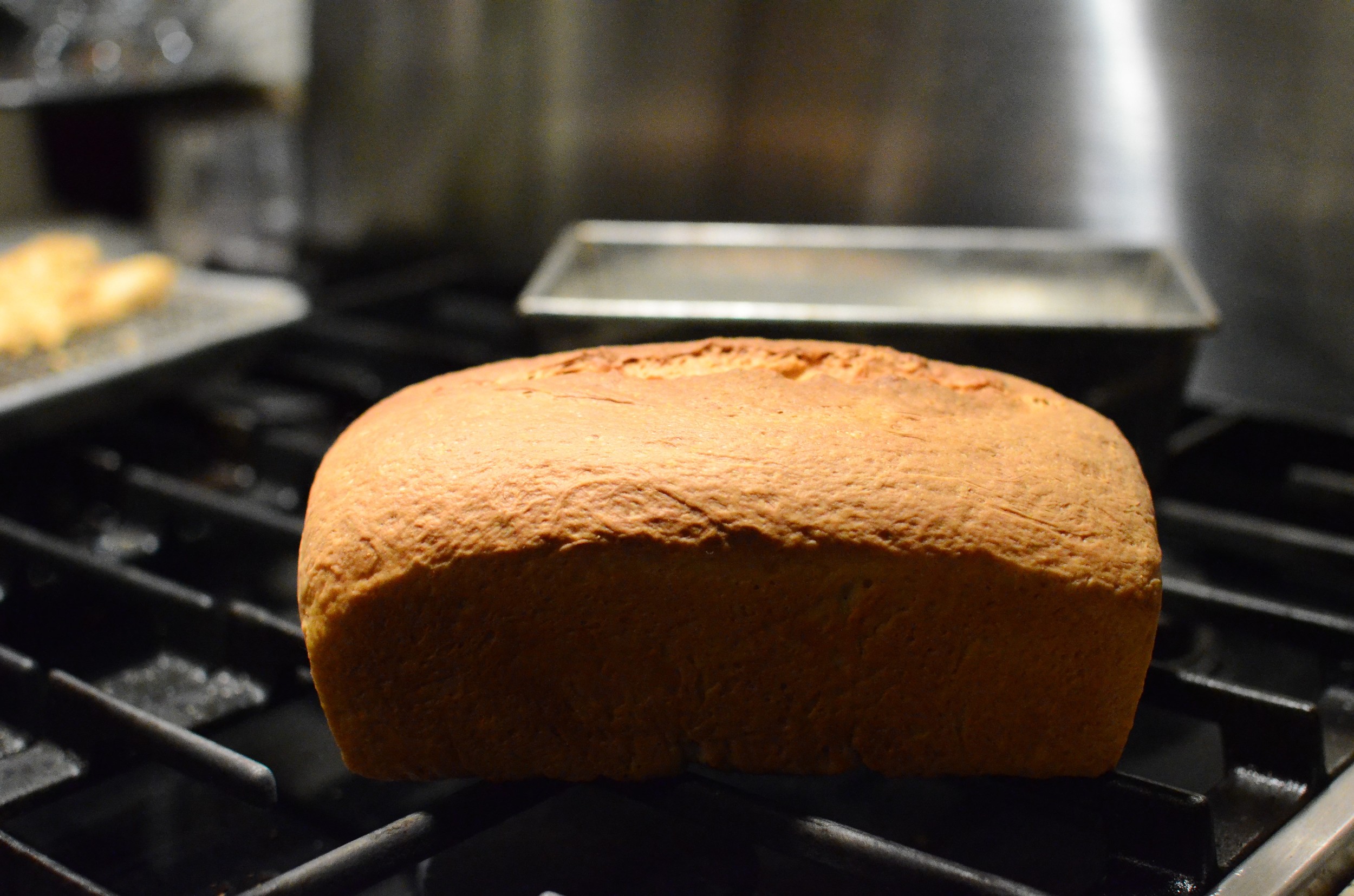 And there you go - a stunning loaf of beautiful homemade bread. It was pure torture waiting for the loaf to cool so we could sample it, but when we did, we devoured almost the entire loaf. It disappeared at an alarming rate so when I noticed there was only an inch or so left, I hid it so I could get a daylight photo. I think it's safe to say we'll be making this bread again.