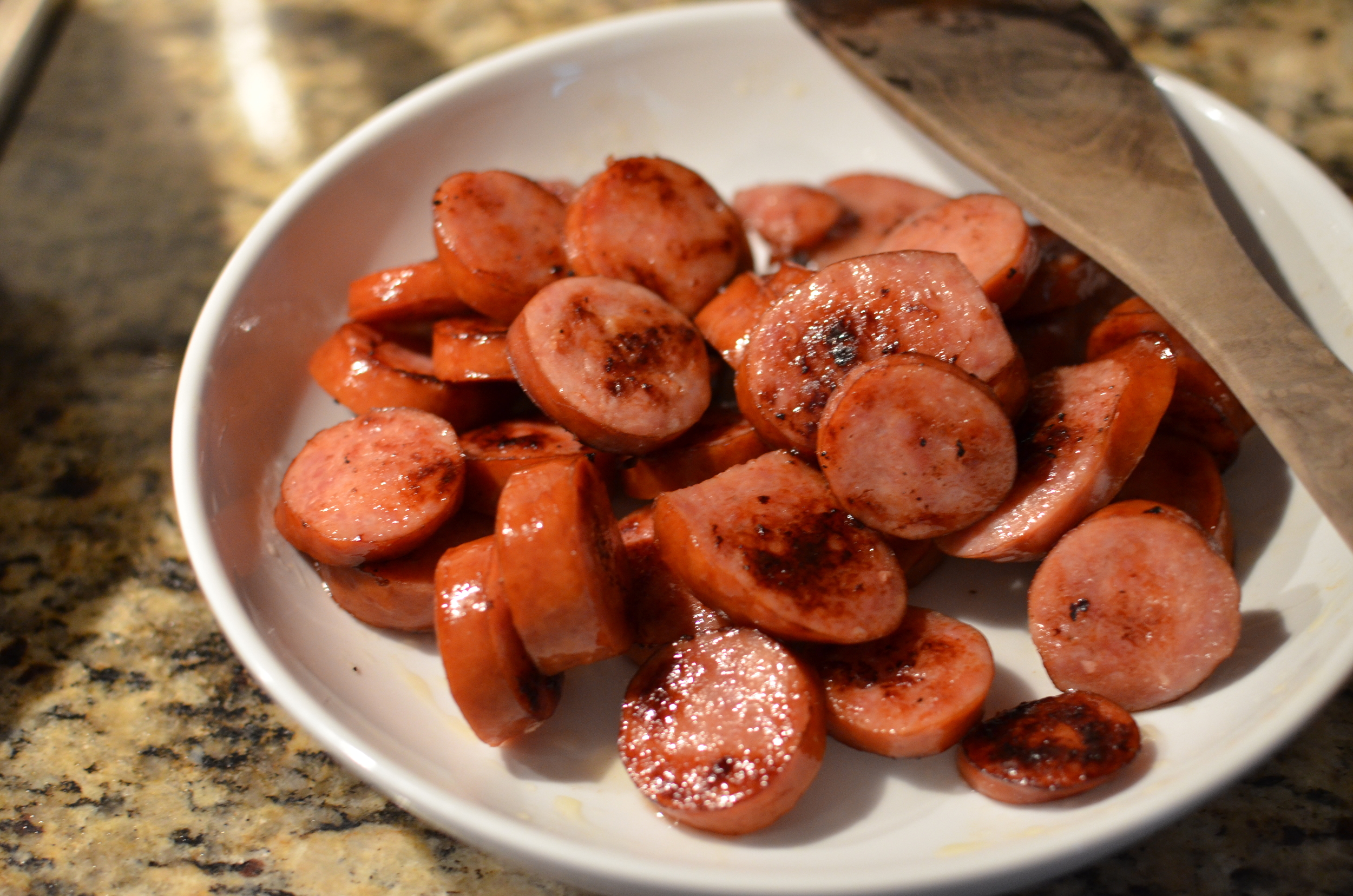 When the kielbasa is brown, remove it from the pan and set aside until later.