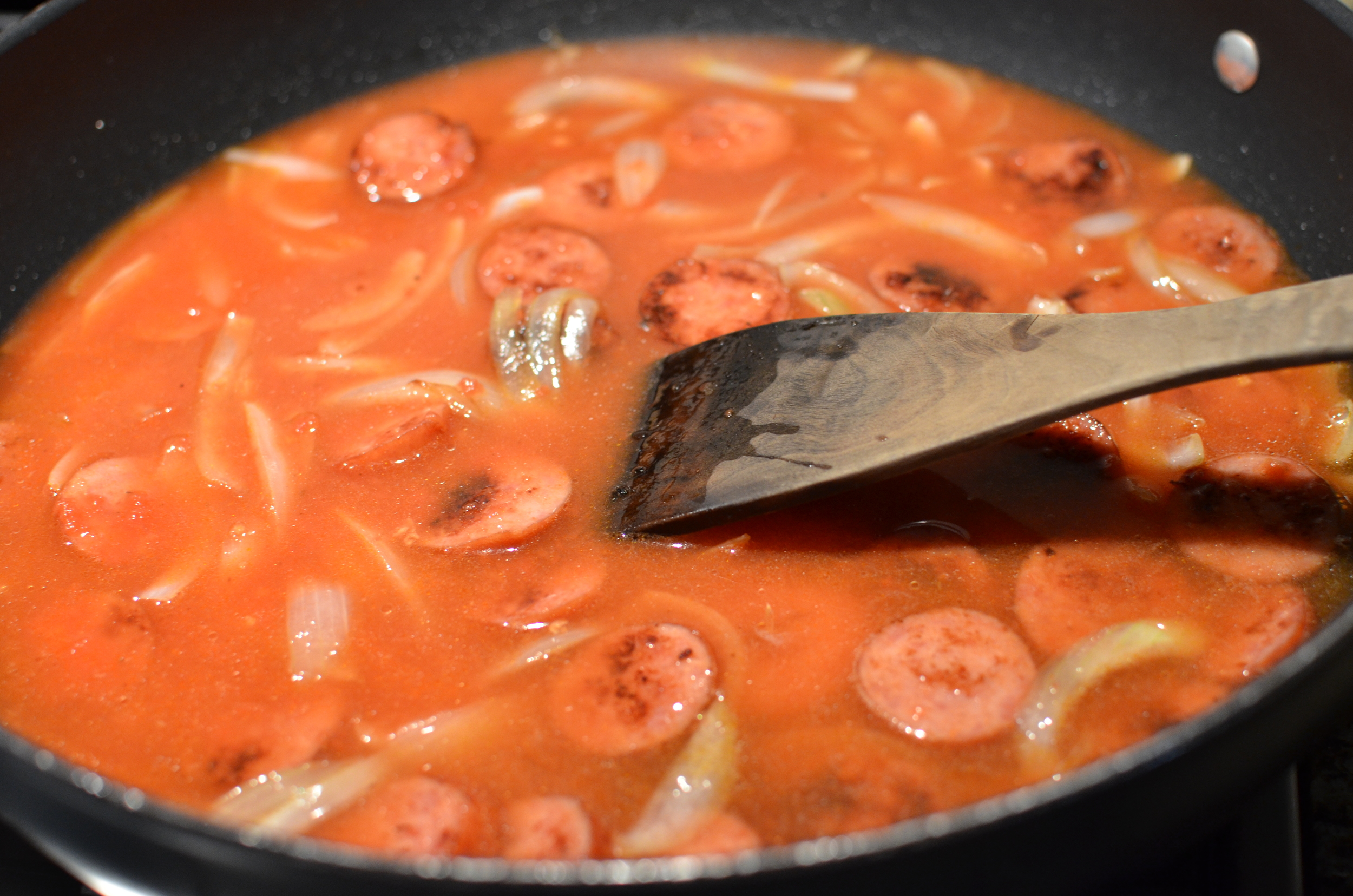 Stir in 4 cups of water. Raise heat and bring mixture to a boil.