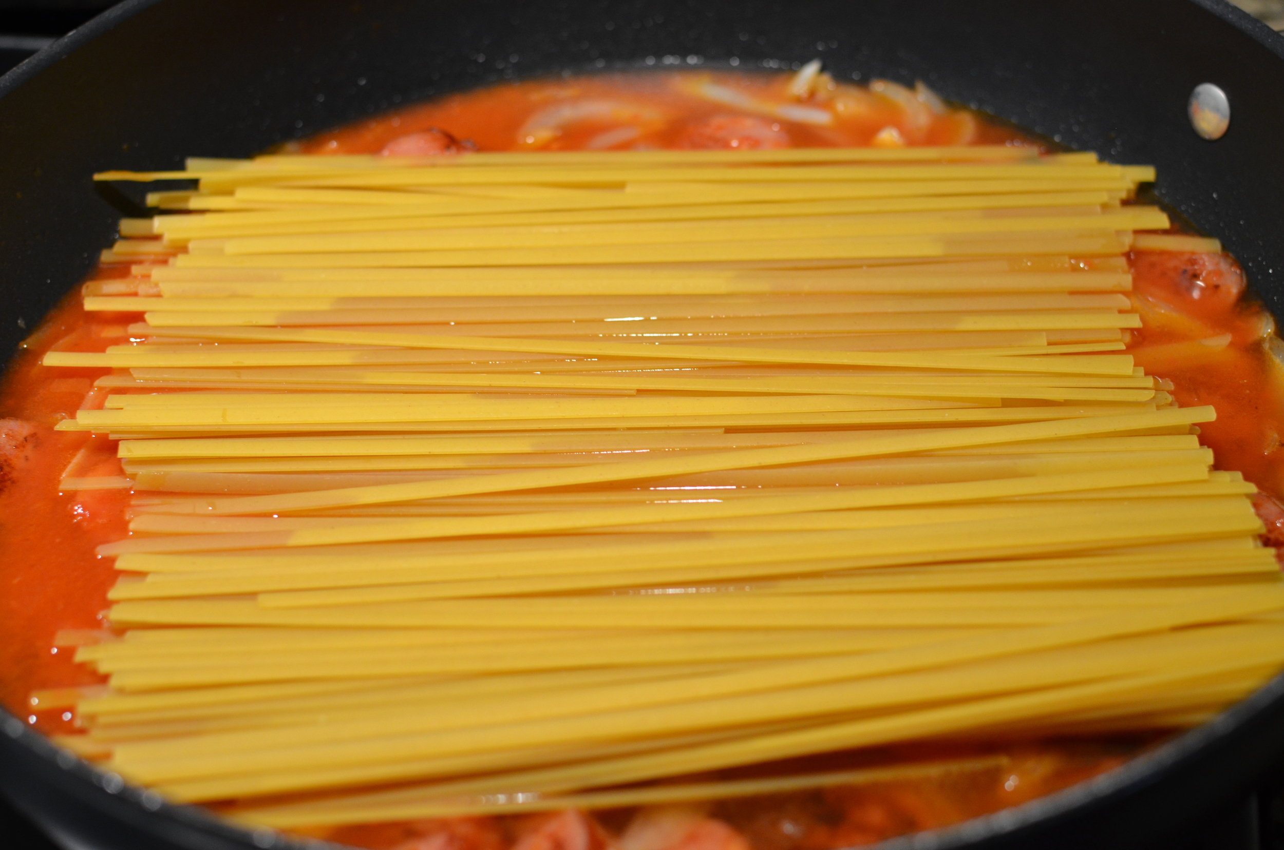 Add 1 pound of dry fettuccini. Be sure to use fettuccine - other pasta would require a different amount of water and I haven't had time to experiment. 