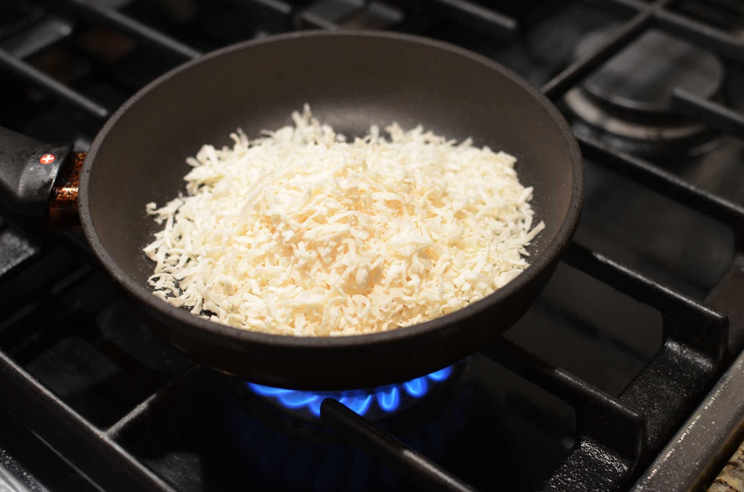 I like to toast coconut in a dry skillet.