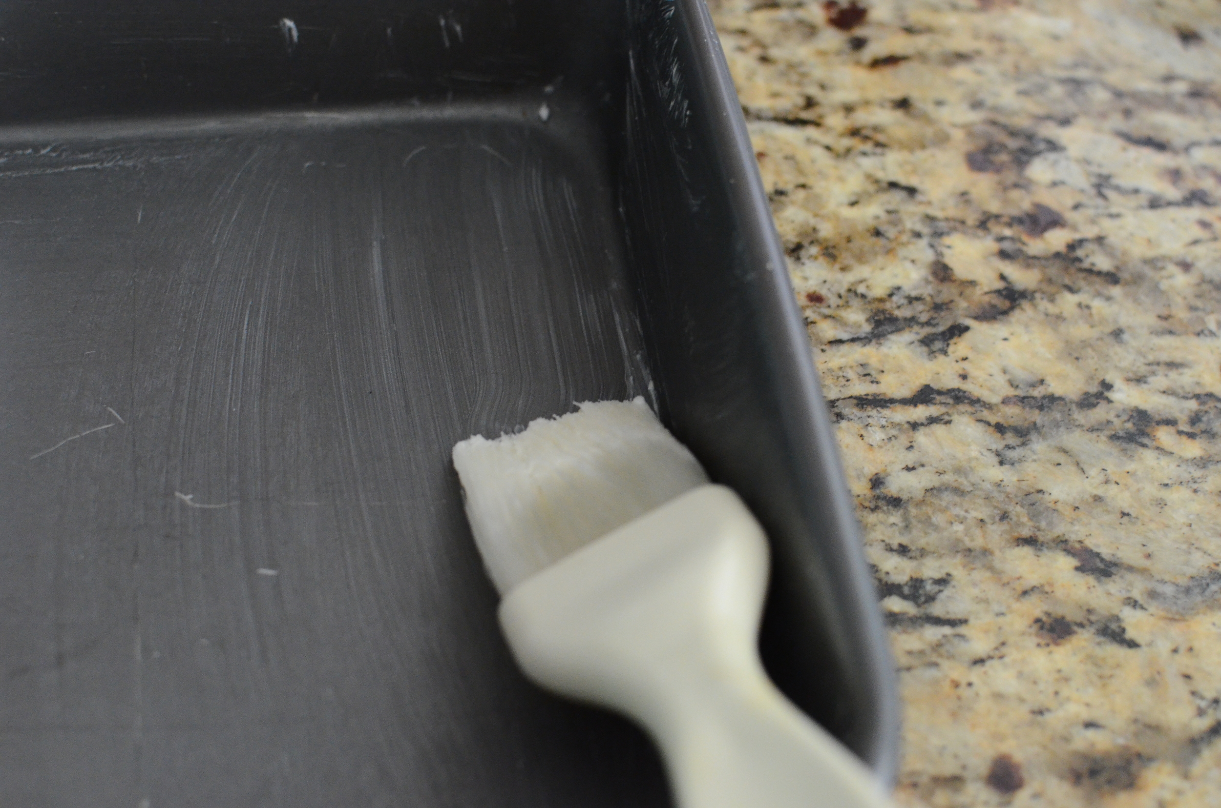 Start by brushing the pan with shortening - this will glue the parchment paper to the pan.