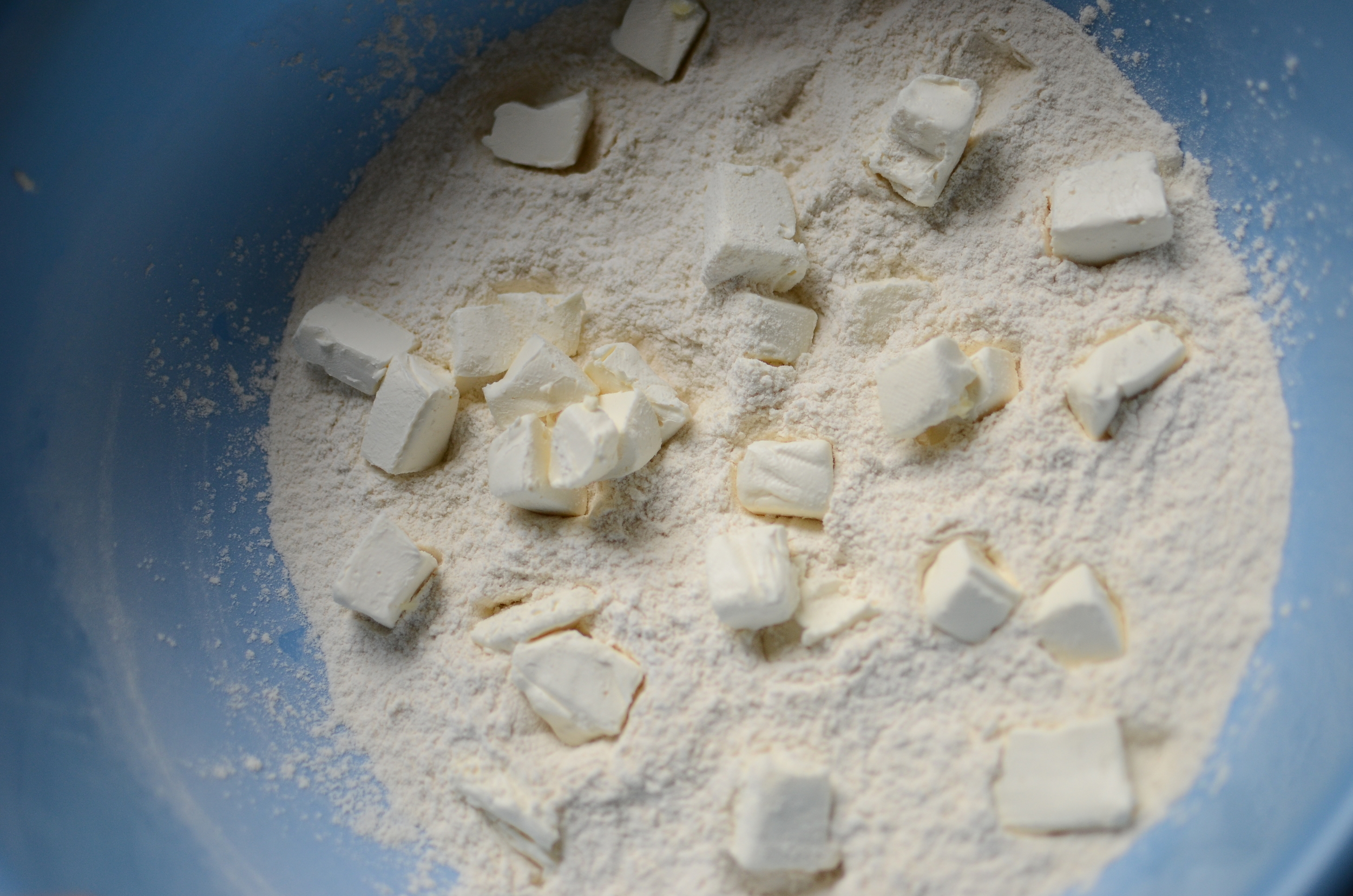 Chilled cubes of cream cheese are added.