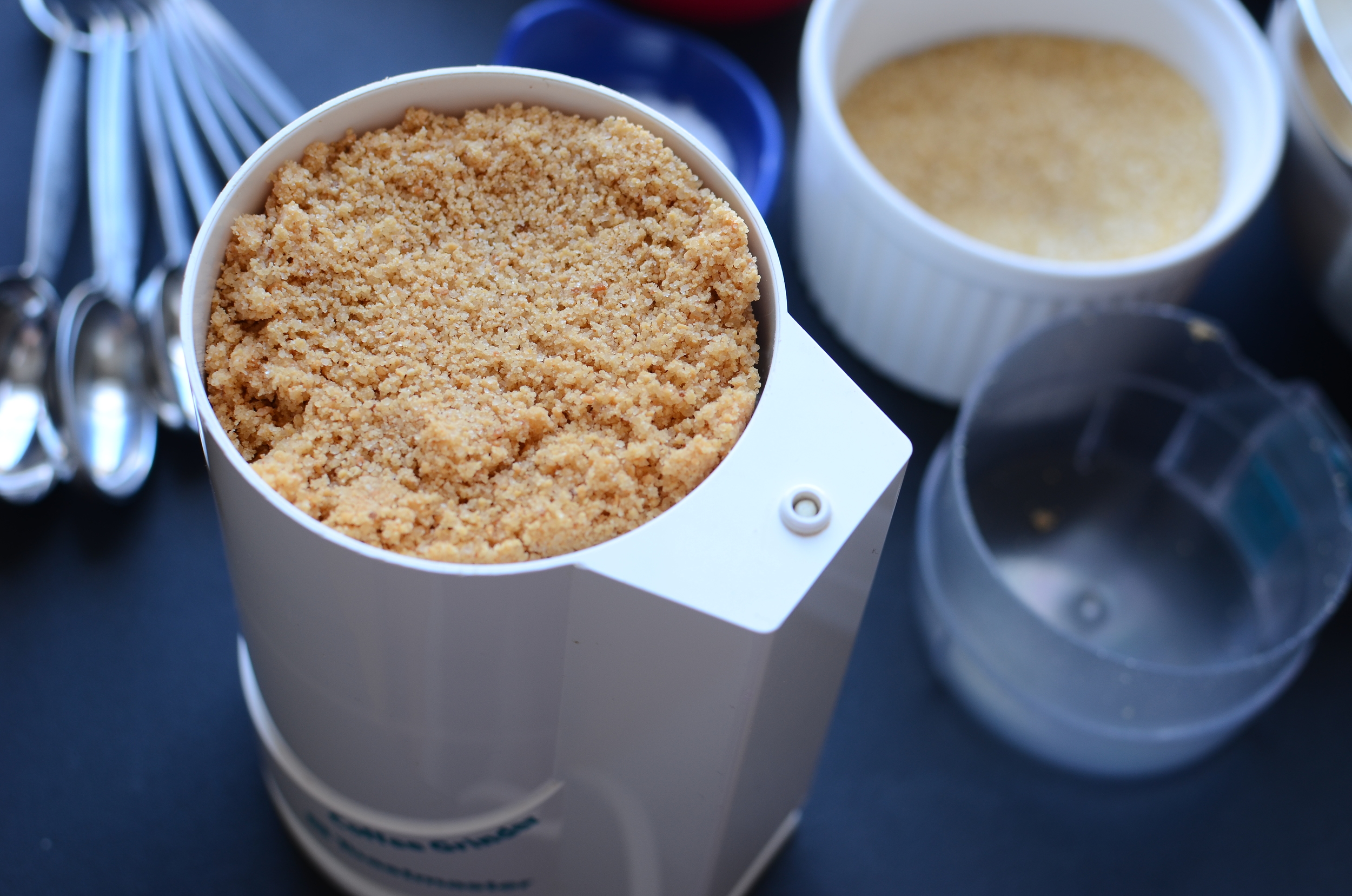 In a spice or coffee grinder, grind the toasted almonds with some of the turbinado sugar until the almonds are finely ground. Set them aside for now.