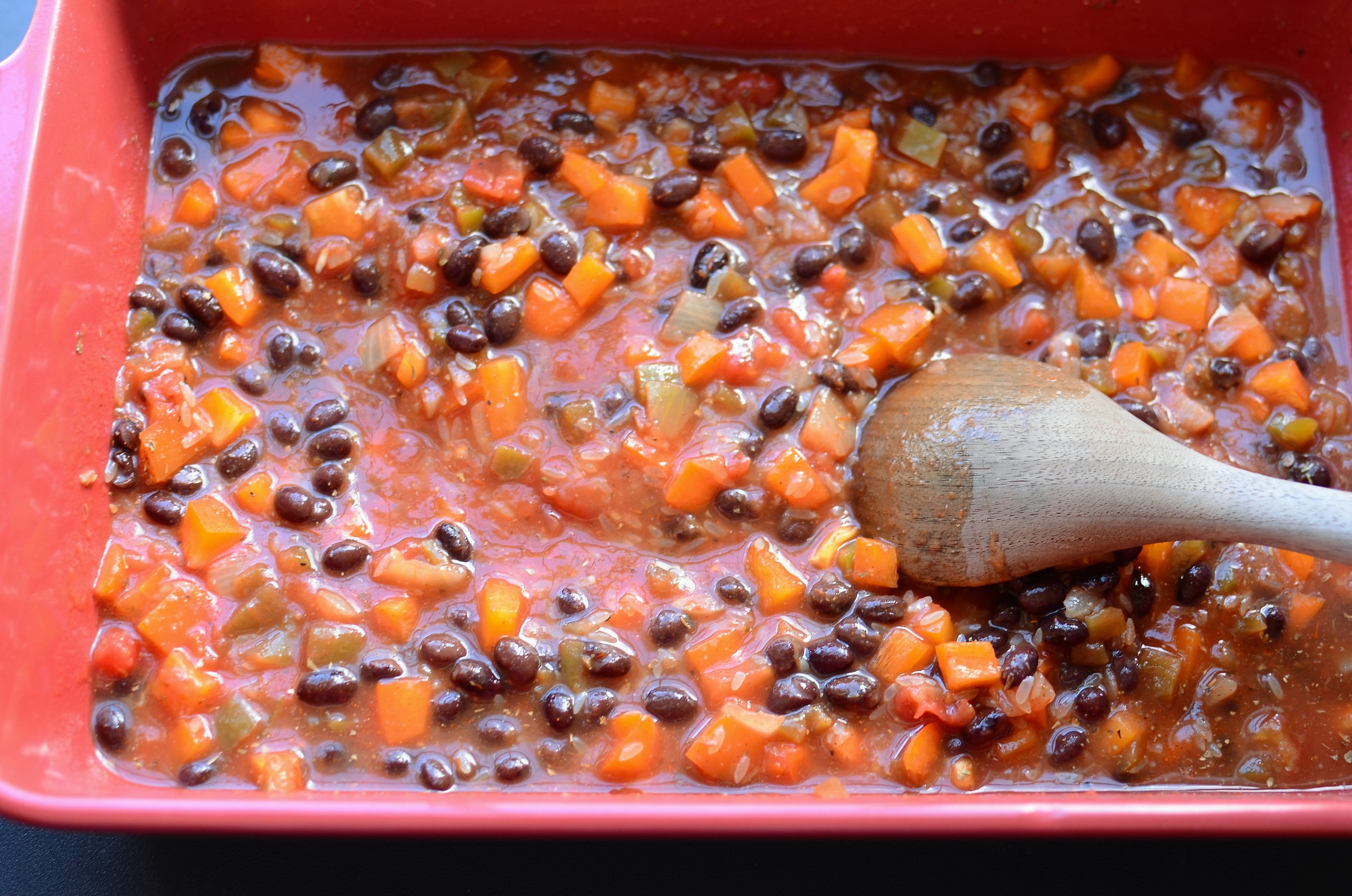 followed by the salsa and chicken stock. Mix everything together.