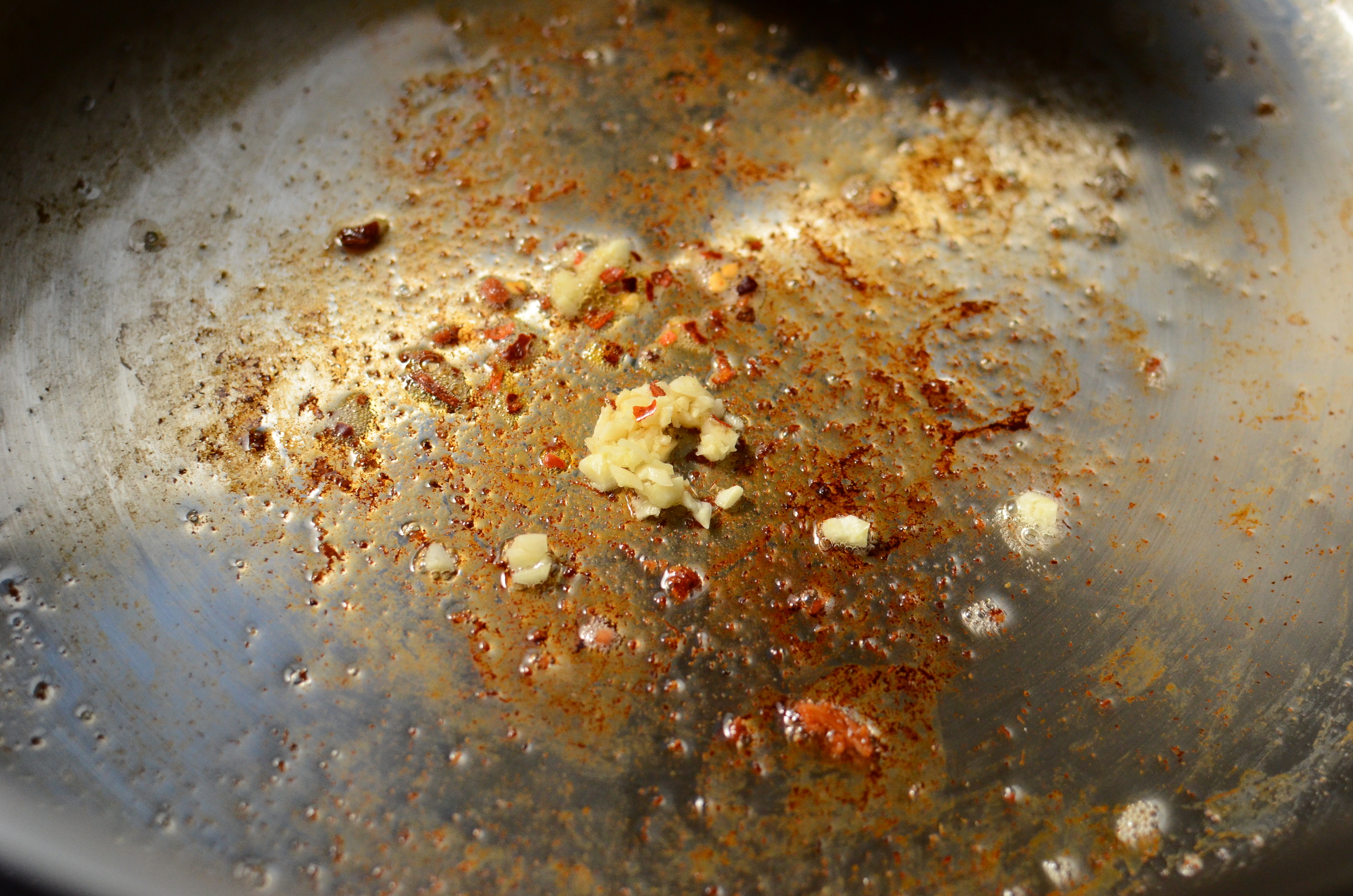 garlic and crushed red pepper in the pan