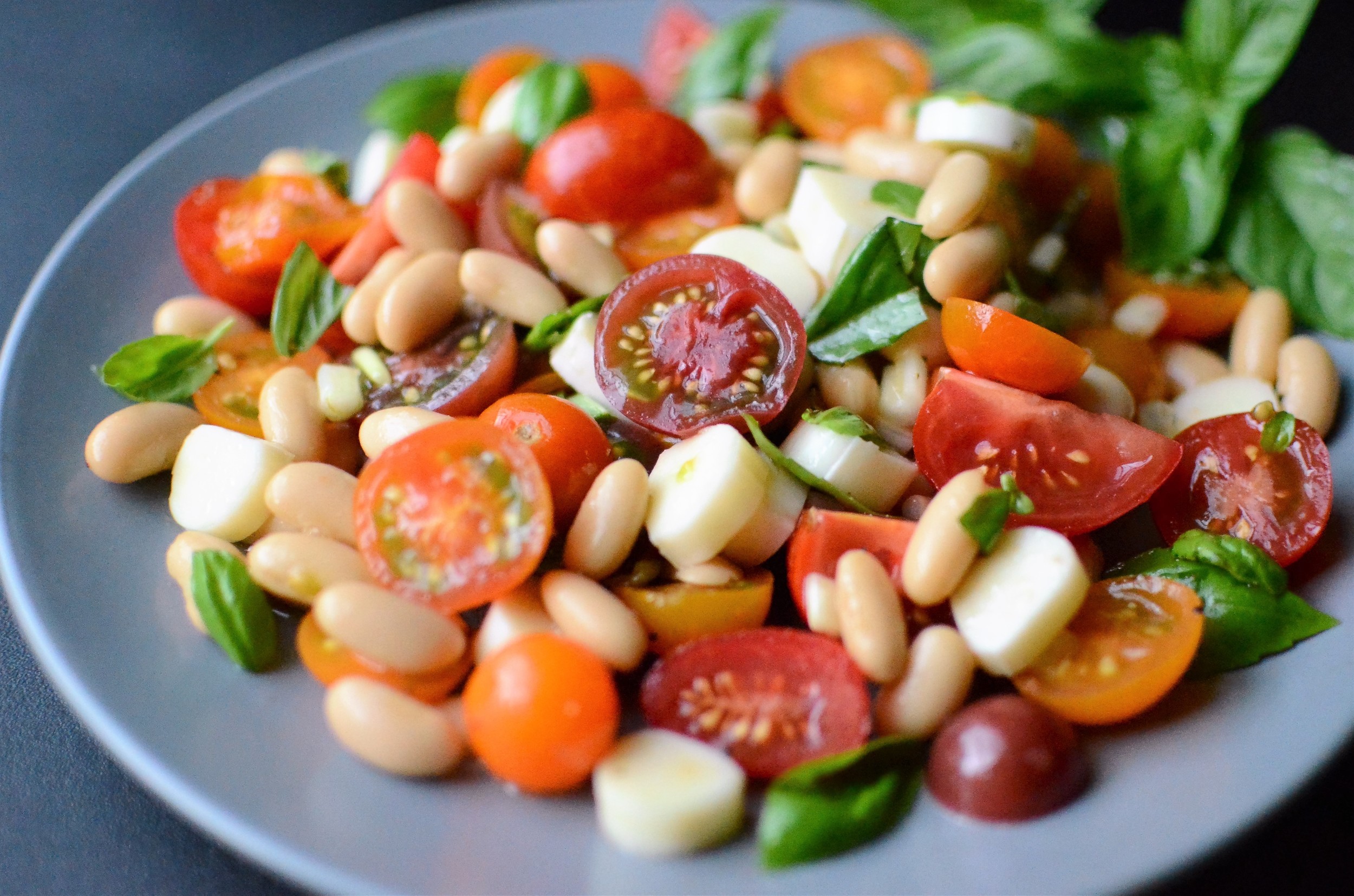 Caprese Bean Salad - ButterYum. a dressed up caprese salad. a twist on caprese salad. caprese salad with cherry tomatoes. caprese salad with grape tomatoes.