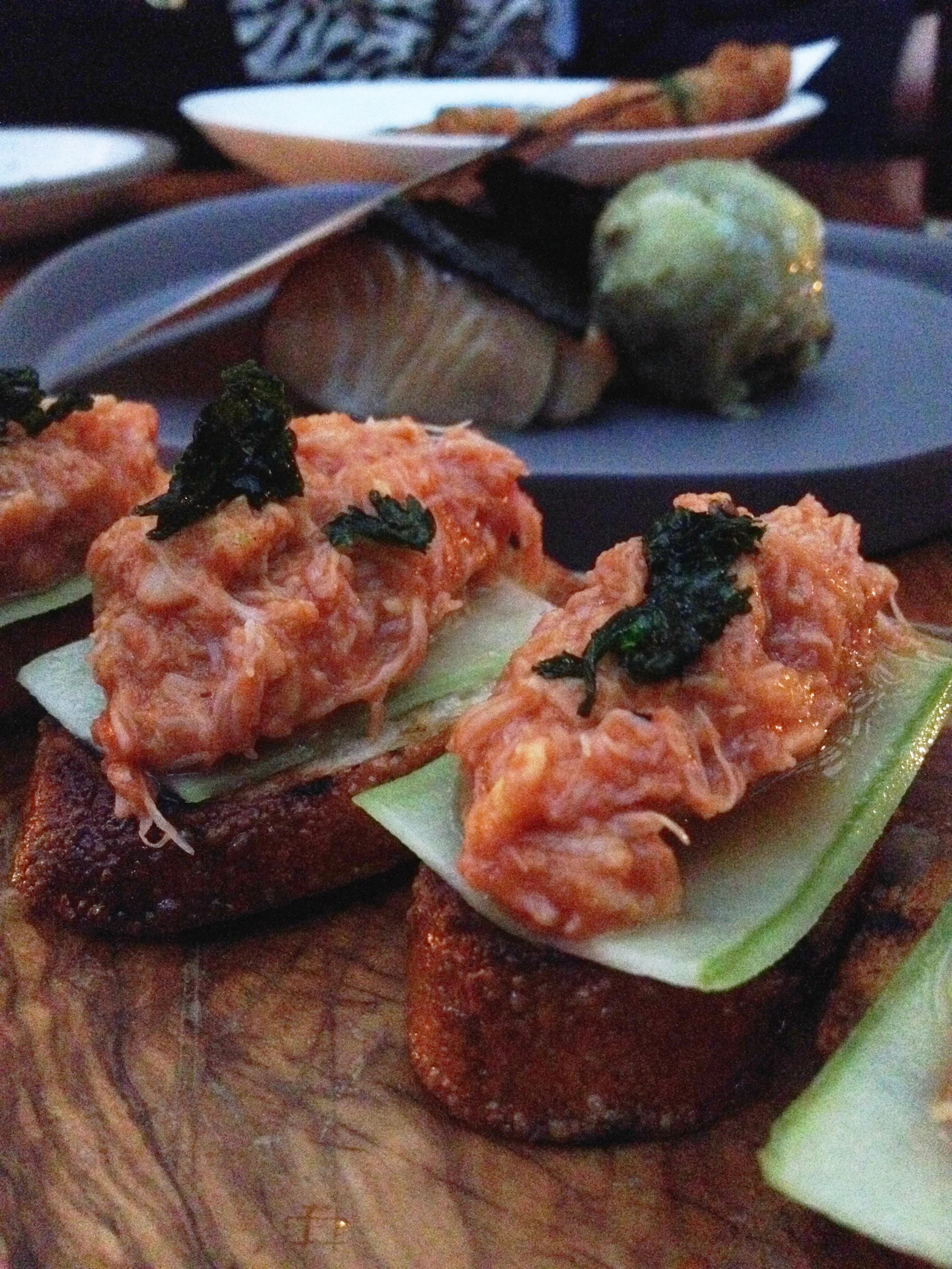 Chili crab toast, spicy cucumber, coriander (behind is the Hinoki-scented black cod with sweet potato and pistachio)
