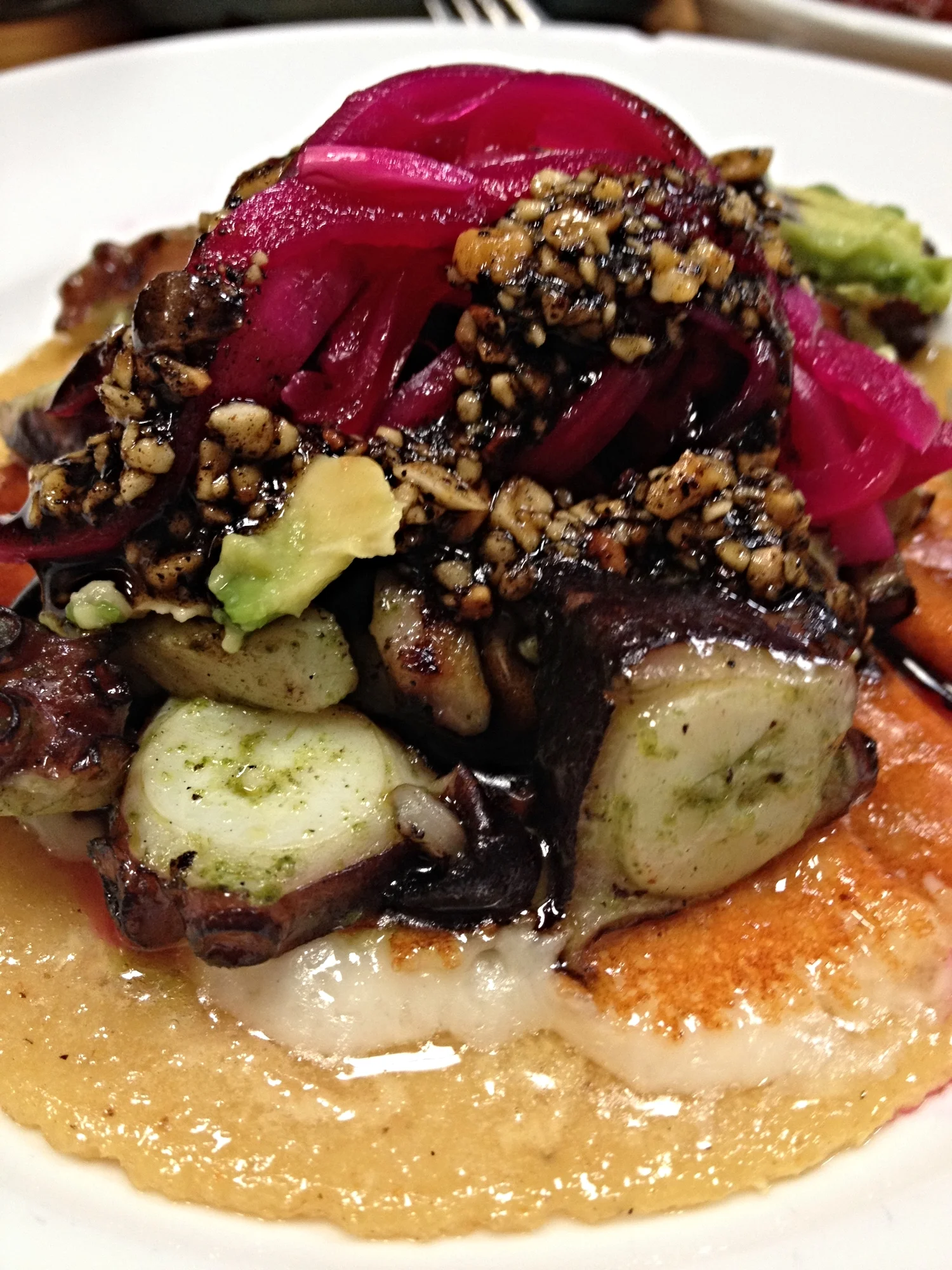Charcoal Grilled Octopus with chile de arbol, peanuts, jack cheese, and avocado