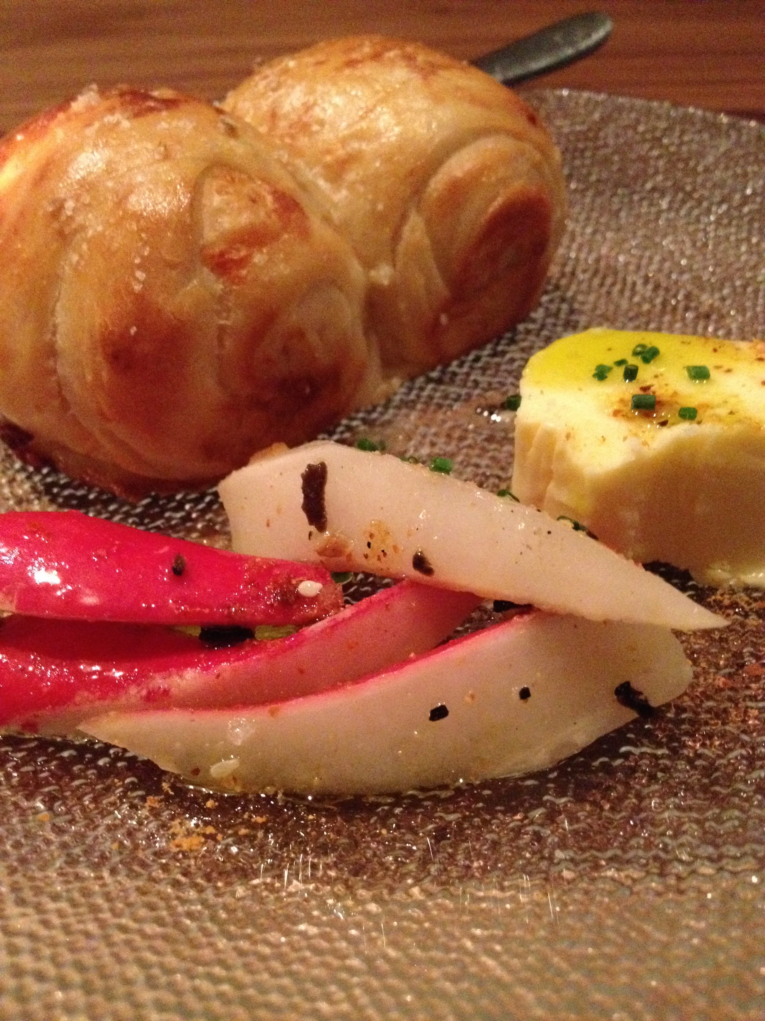 House-made milk-bread foccacia with pickled radish and oregano butter