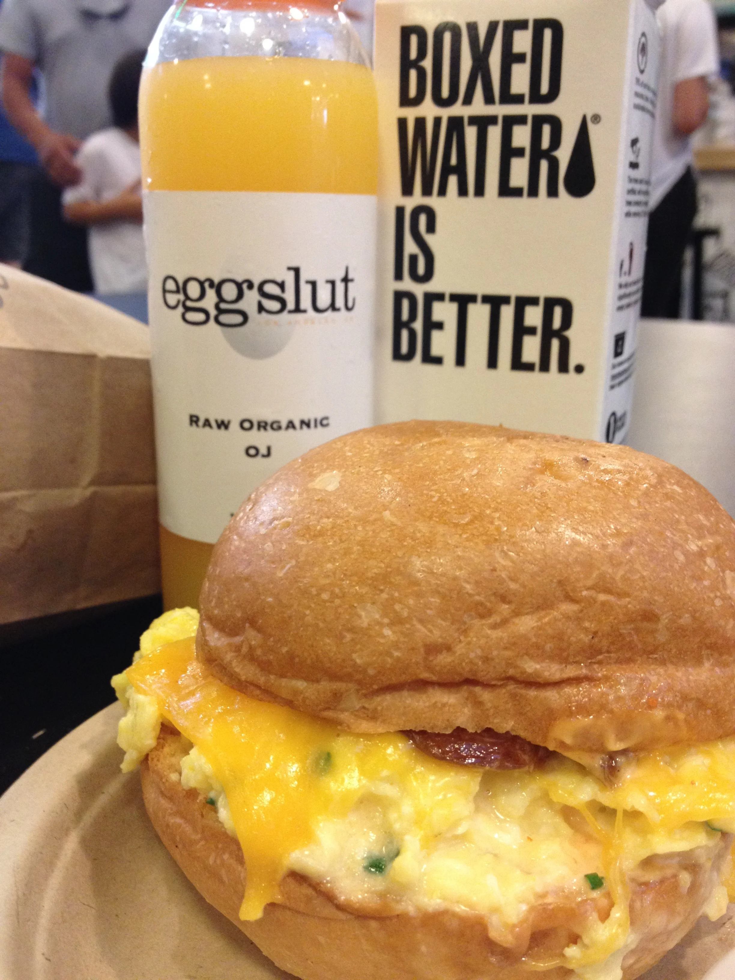 The Fairfax - soft scrambled eggs, chives, cheddar cheese, caramelized onions and Sriracha mayo in a warm Portuguese bun.