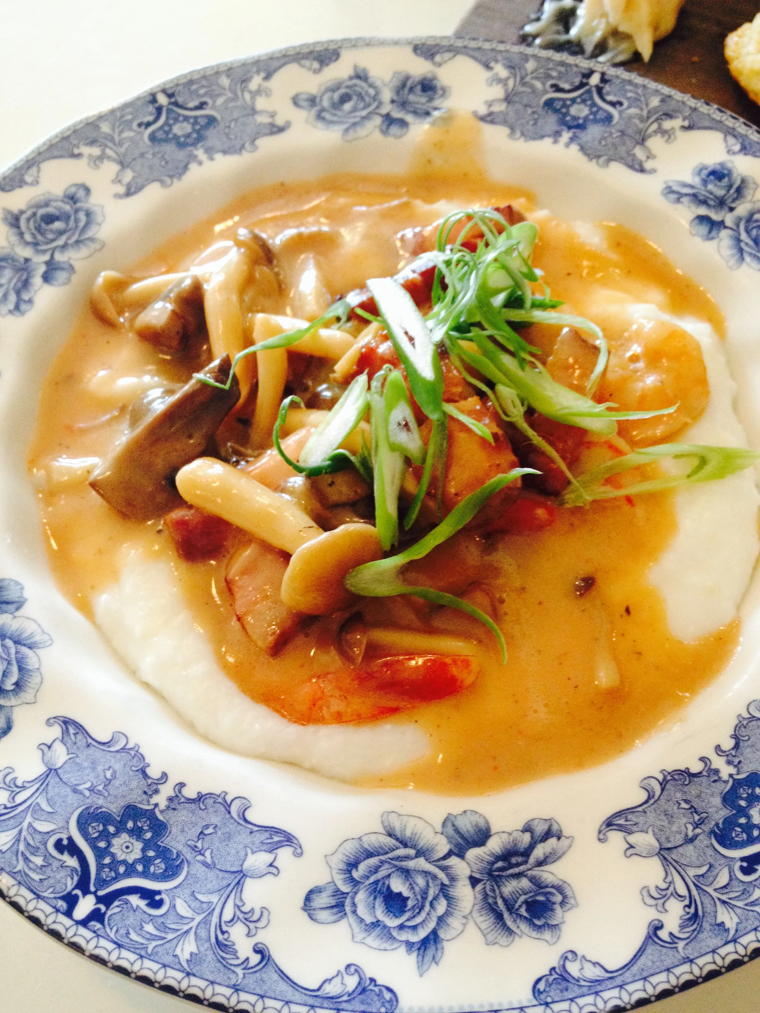 Shrimp and Grits with bacon, mushrooms, and scallions.