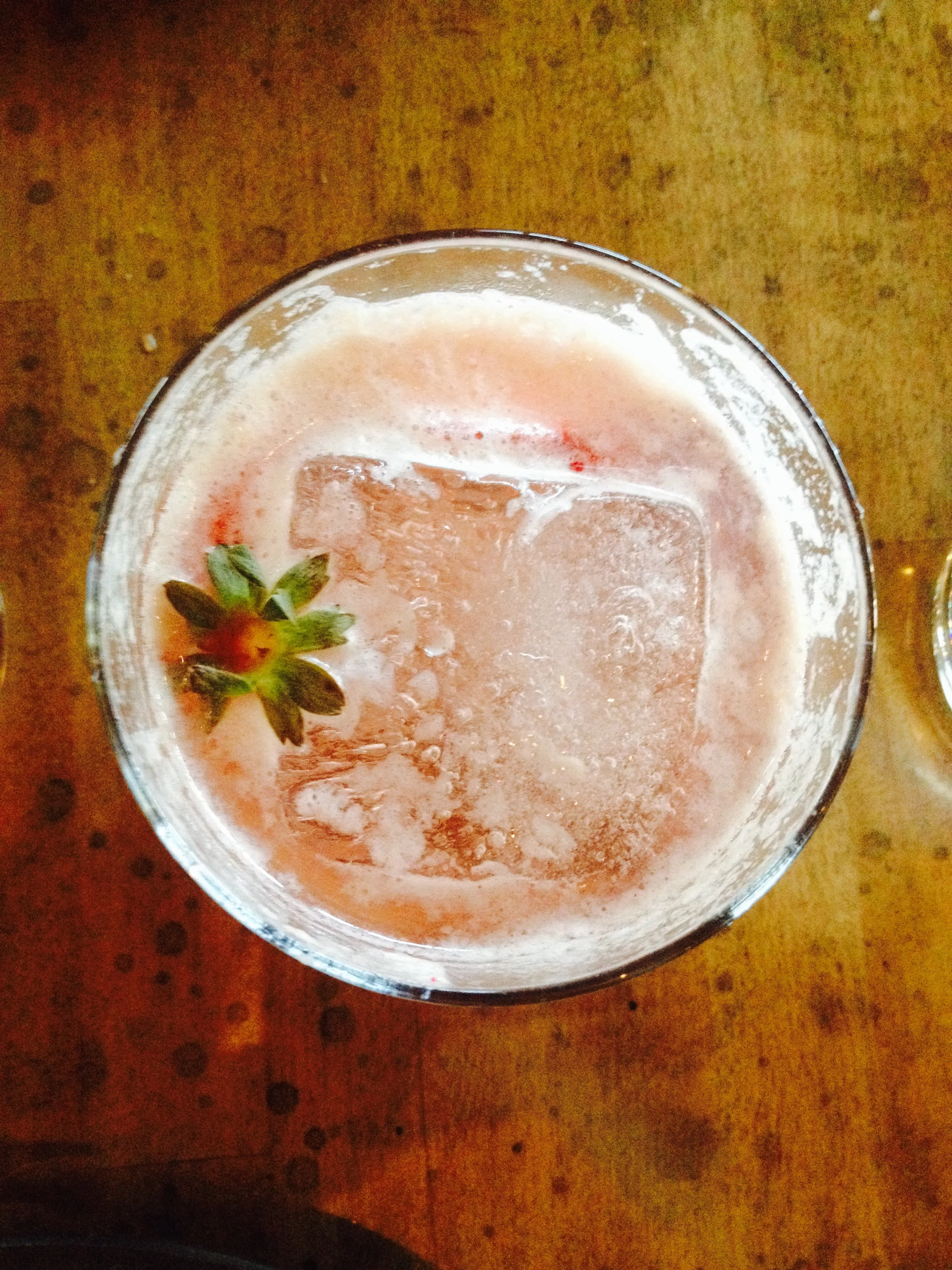 Tequila cocktail with, strawberry, rose water, sherry, verjus, and lambic.
