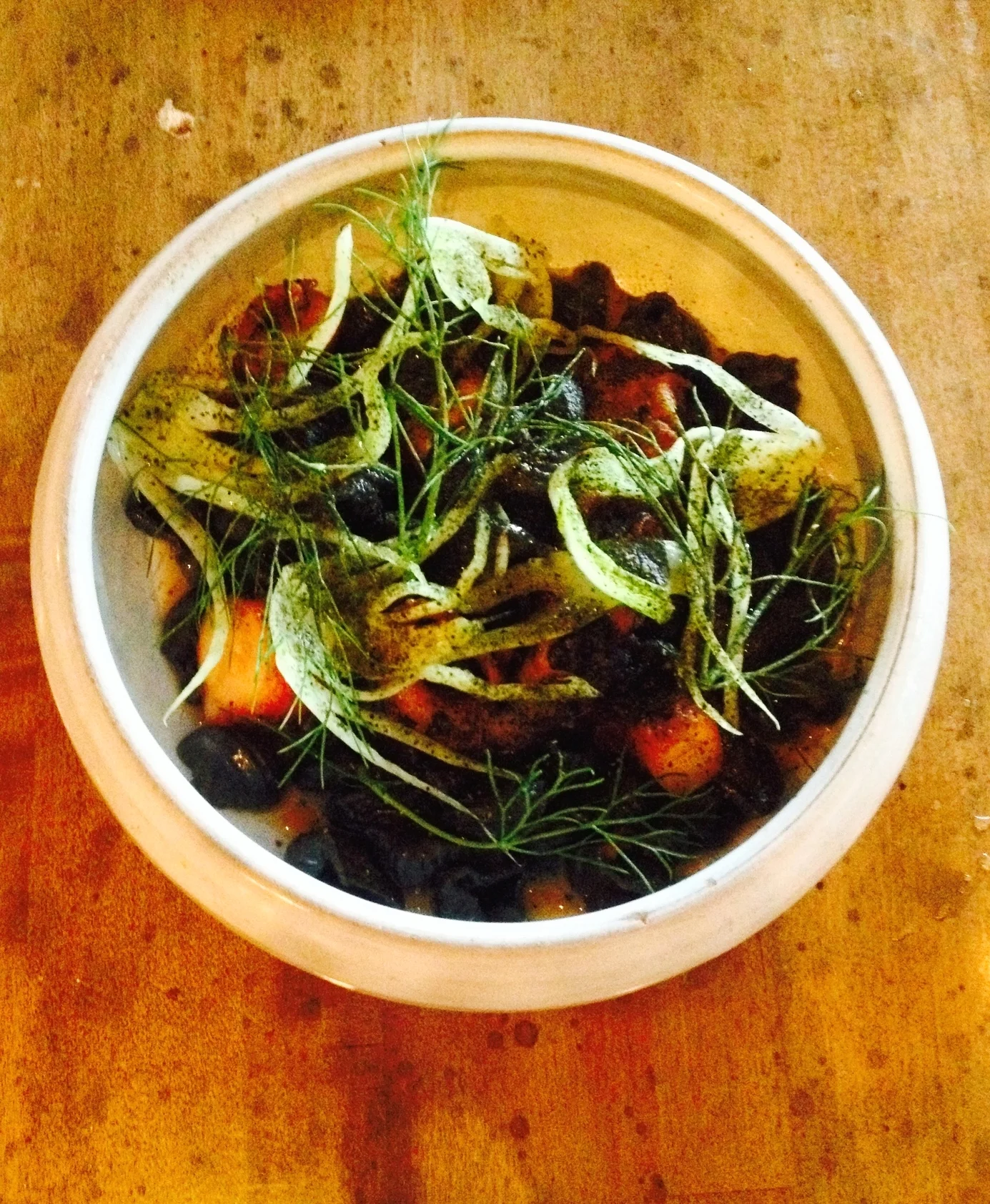 Grilled Octopus with squid ink pasta shells, fennel, and pimentón.