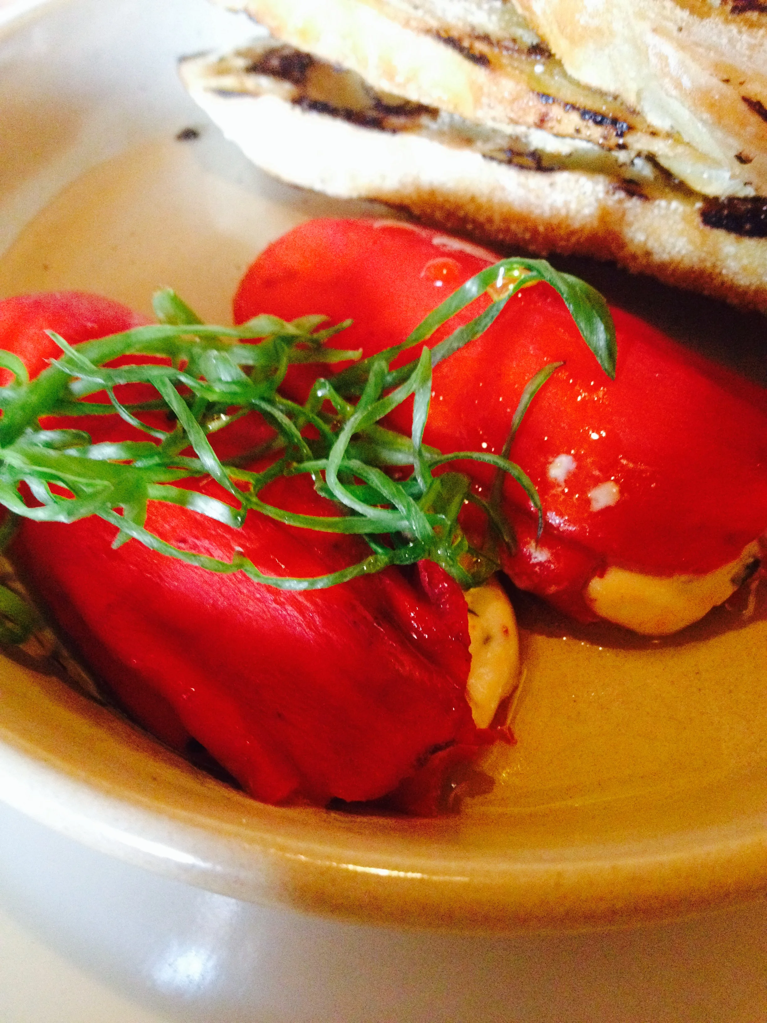 Stuffed Piquillo Peppers with herbed Spanish goat cheese and grilled bread.