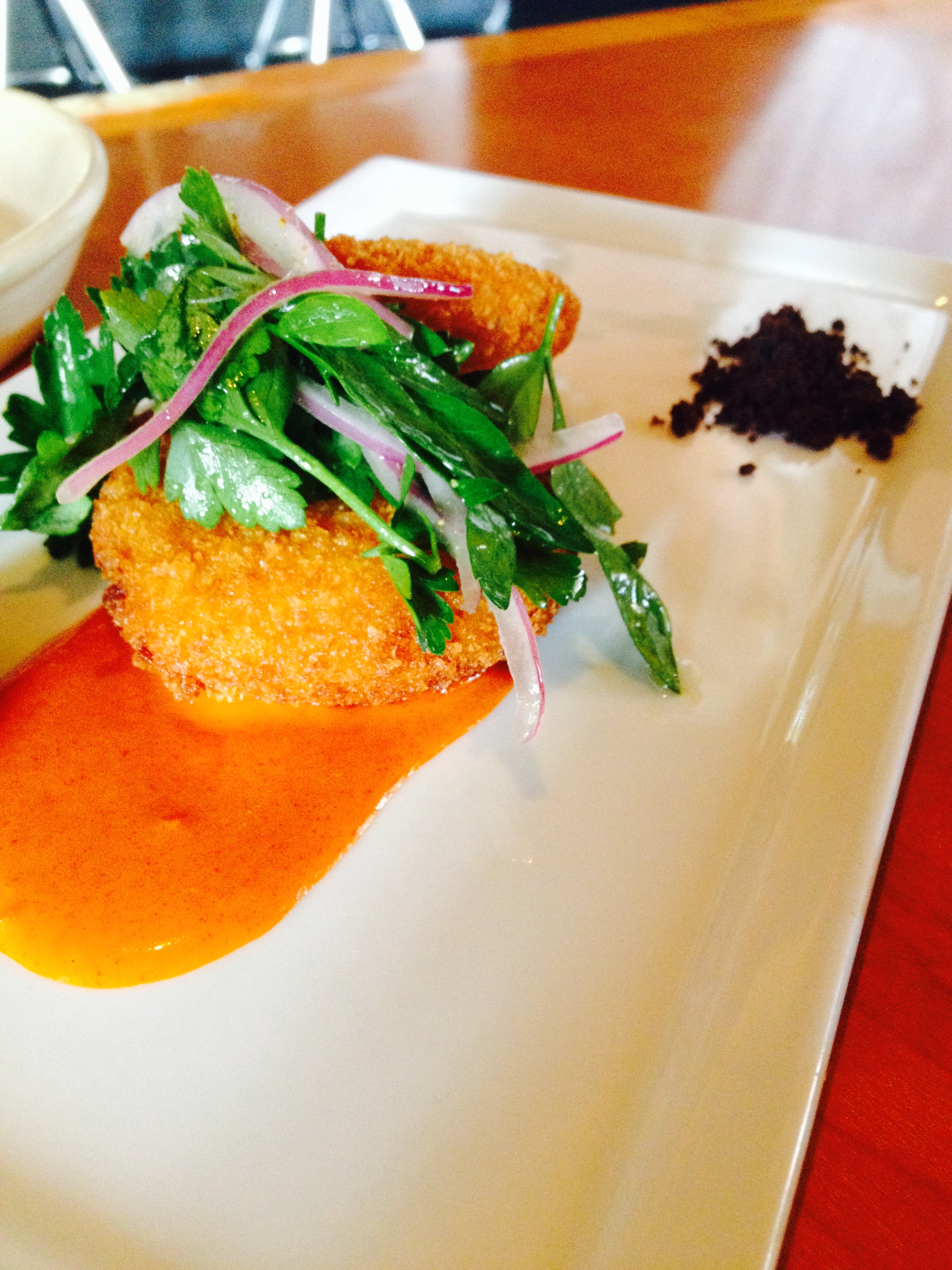 Salt Cod Brandade Fritters with piquillo gastrique, pimento aioli, and olive "soil."