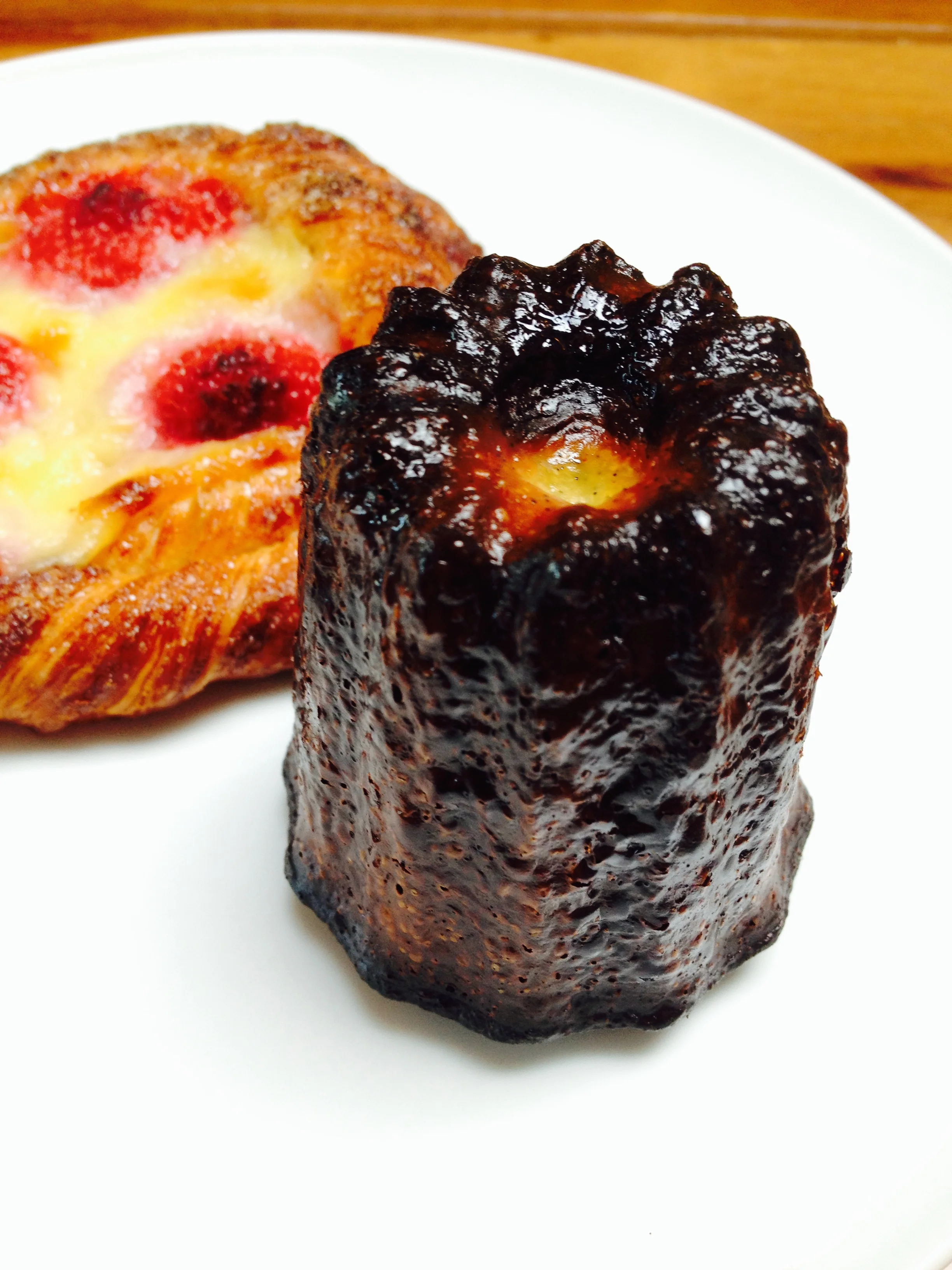 The most amazing canelé, plus a Cinnamon Twirl with raspberries.