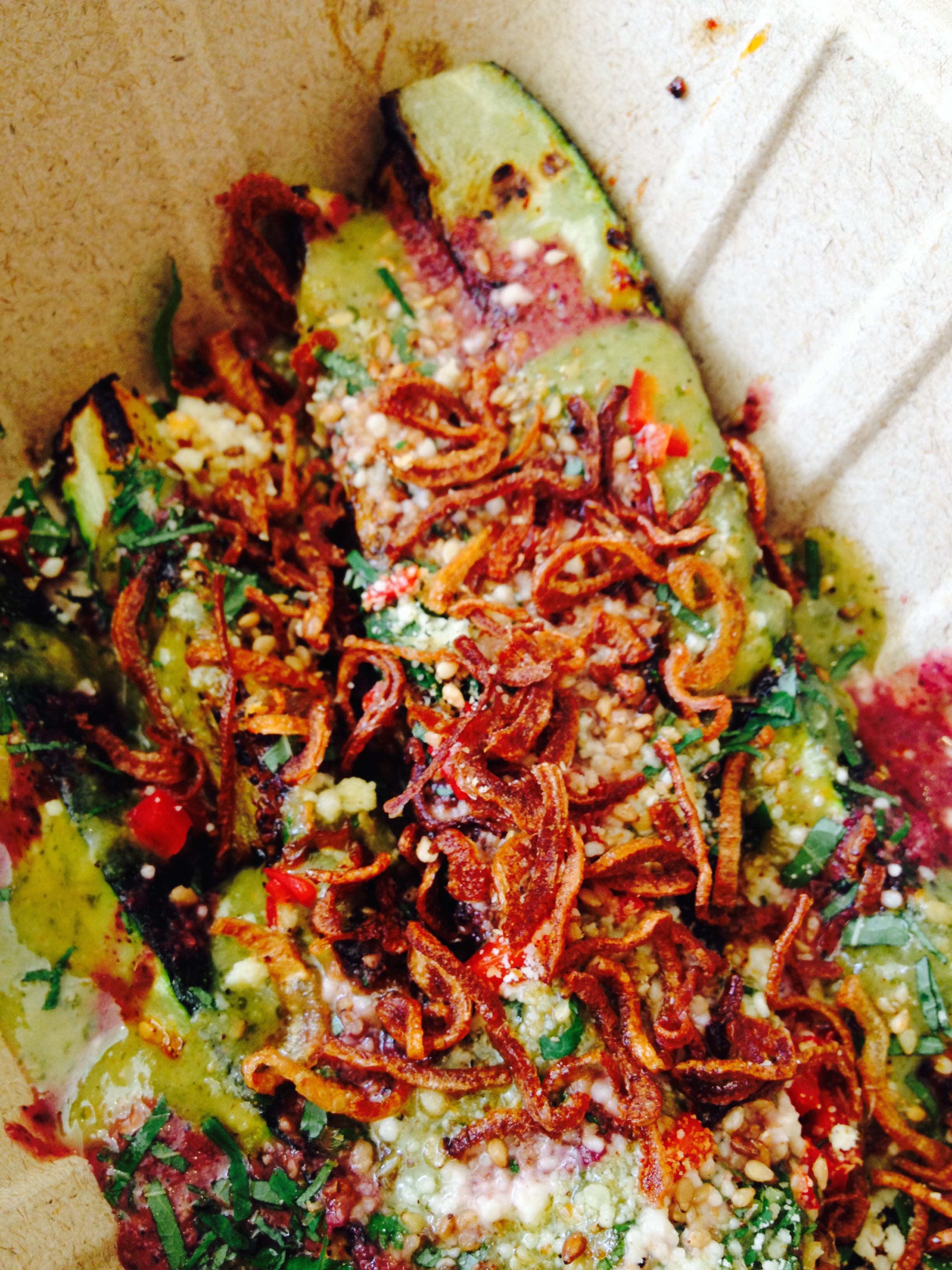 Seasonal vegetables - charred zucchini with salsa verde, salsa azul, parmesan, fried shallots, lemon, and toasted sesame.
