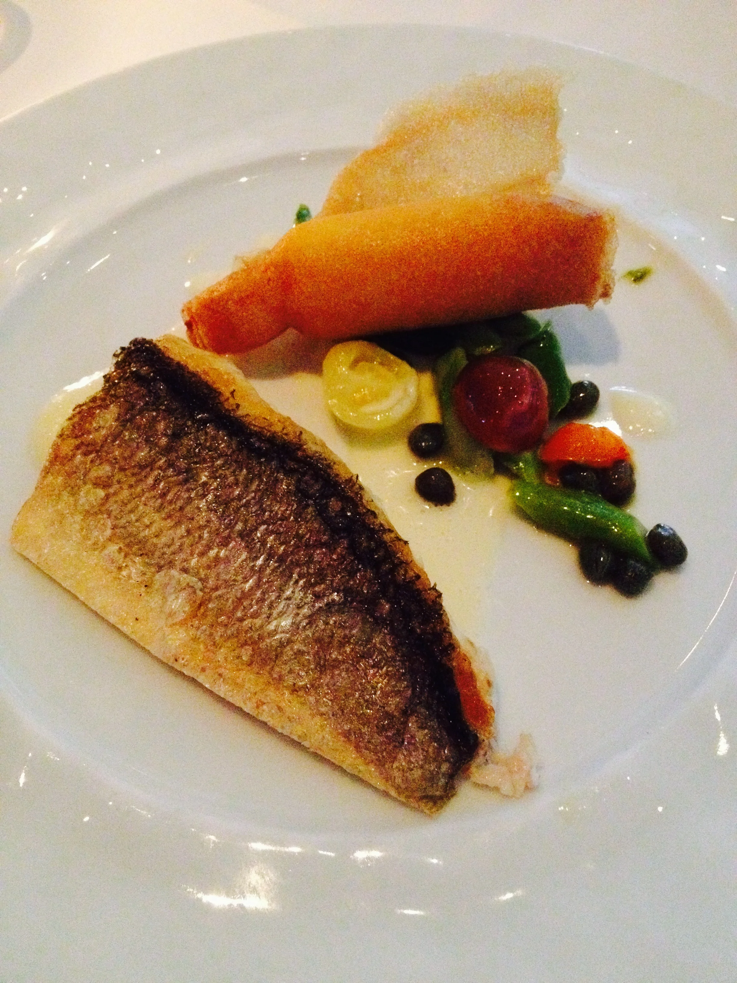 il branzino with crispy polenta, asparagus, capers, and tomatoes