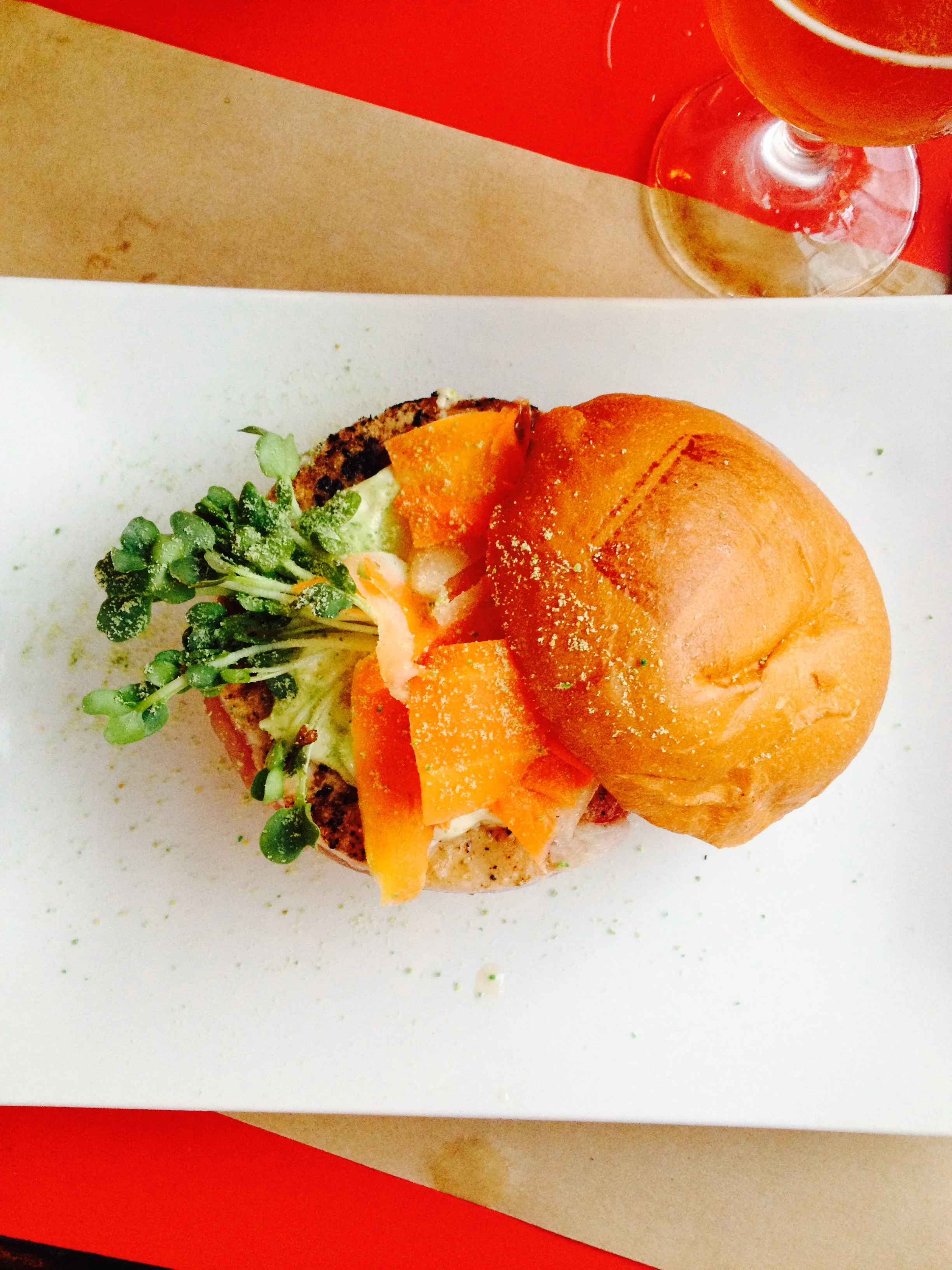 The Ahi Tuna Burger with hand-chopped ahi tuna, crushed avocado, daikon sprouts, pickled ginger, wasabi flakes.