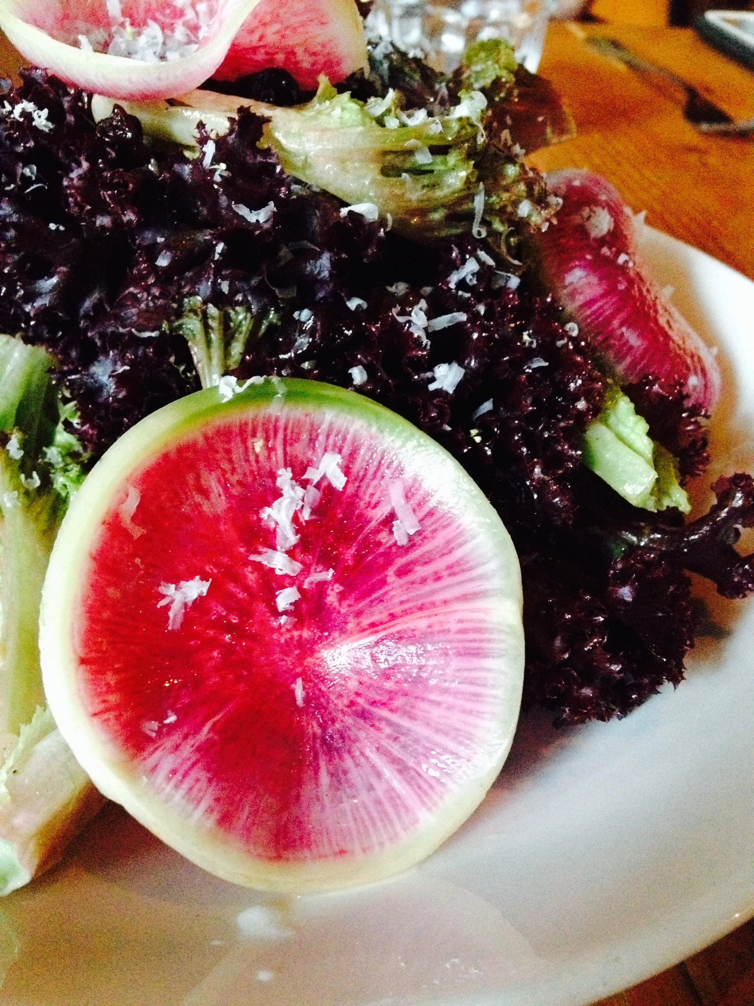 Lolla Rossa salad with watermelon radish, smoked caciocavallo cheese, sour cherries, and shallot vinaigrette.