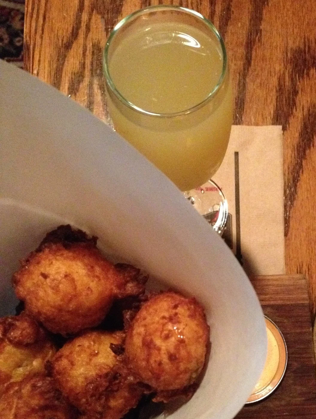 SWEET CORN FRITTERS with fresno chili aioli and a SCOTCH LASSIE with famous grouse, apricot and ginger liquor topped with prosecco