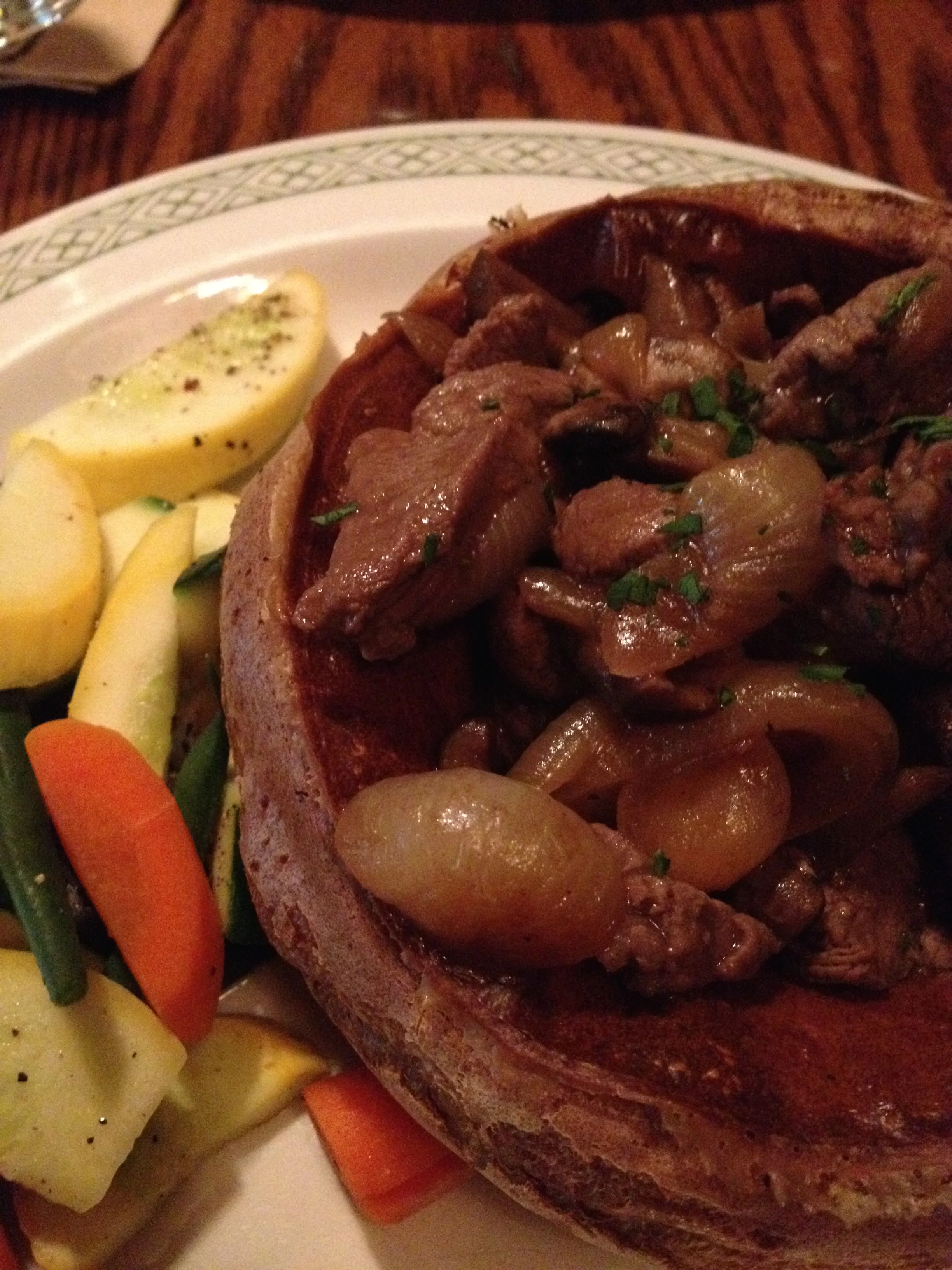 TOAD IN THE HOLE (a Tam signature) with filet mignon, yorkshire pudding, pearl onions, mushrooms & burgundy wine sauce