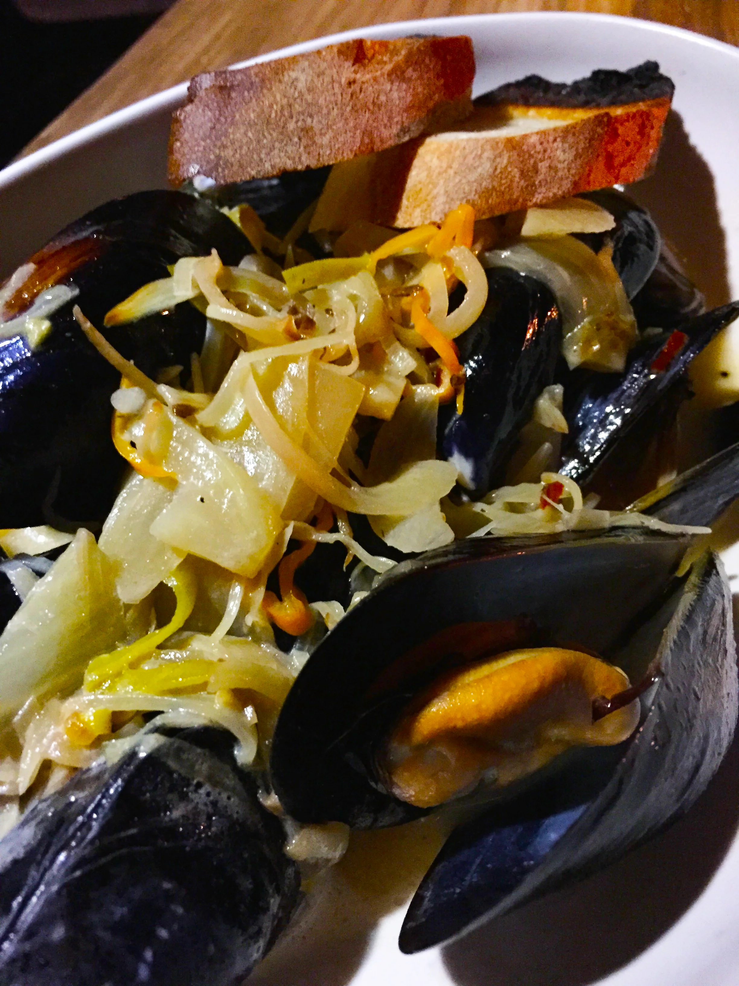  Mussels with white beer, c rème fraîche, fennel, leeks, charred lemon, and habañero.