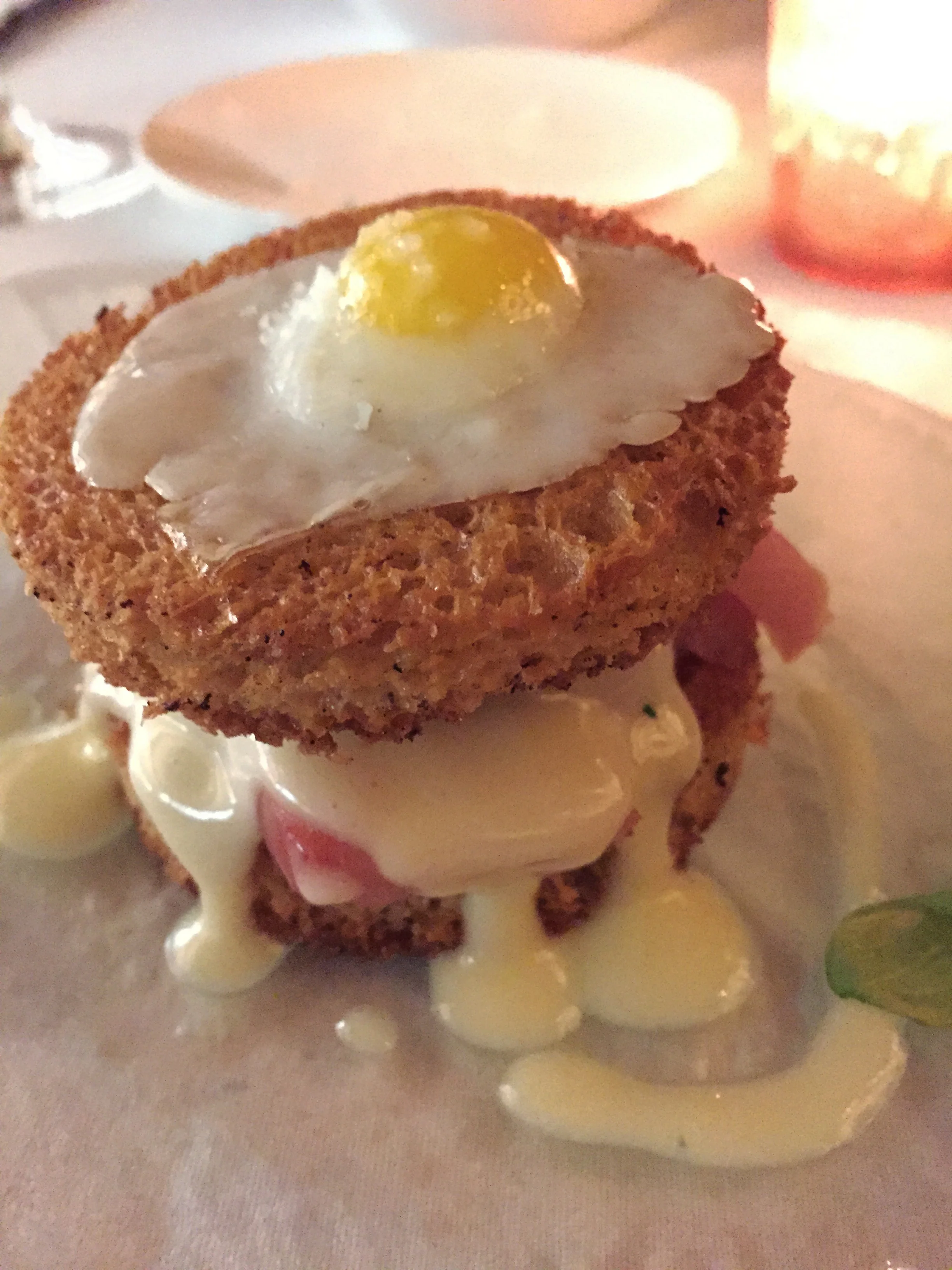 "Croque Madame" with Yellowtail sashimi, prosciutto, sunny side up quail egg, and grilled brioche.