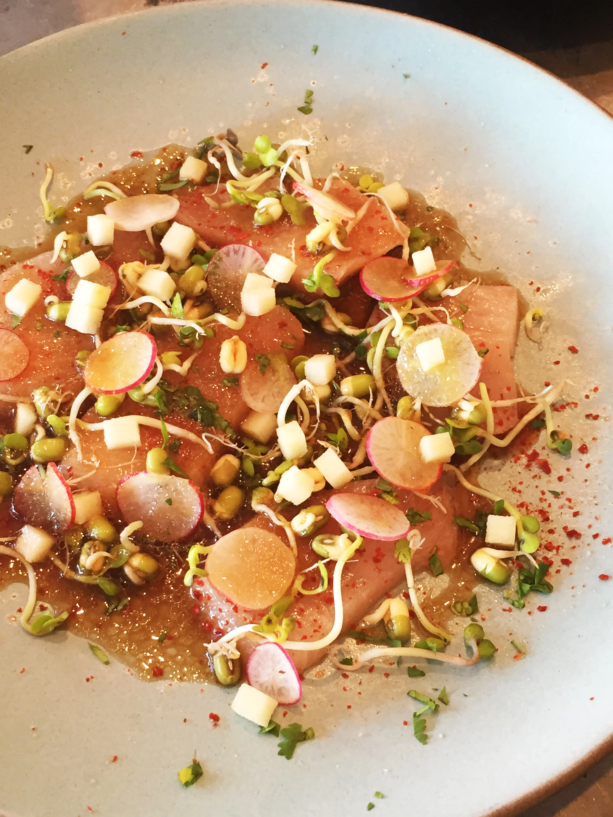 Hamachi Sashimi with Galbi Vinaigrette, Pink Lady Apple, and Radishes.