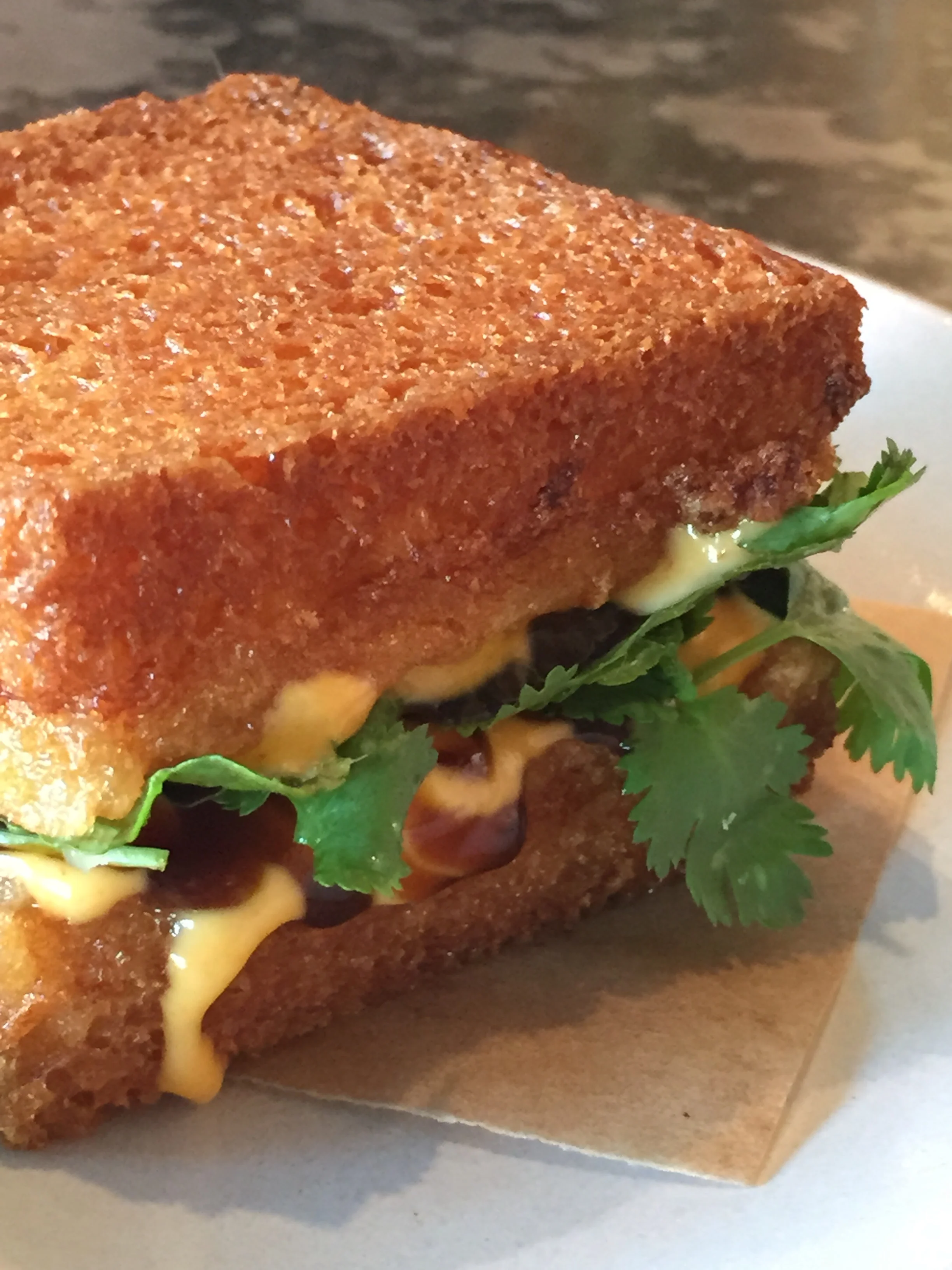 Shrimp Toast Sandwich with Herbs and Sriracha Mayo.