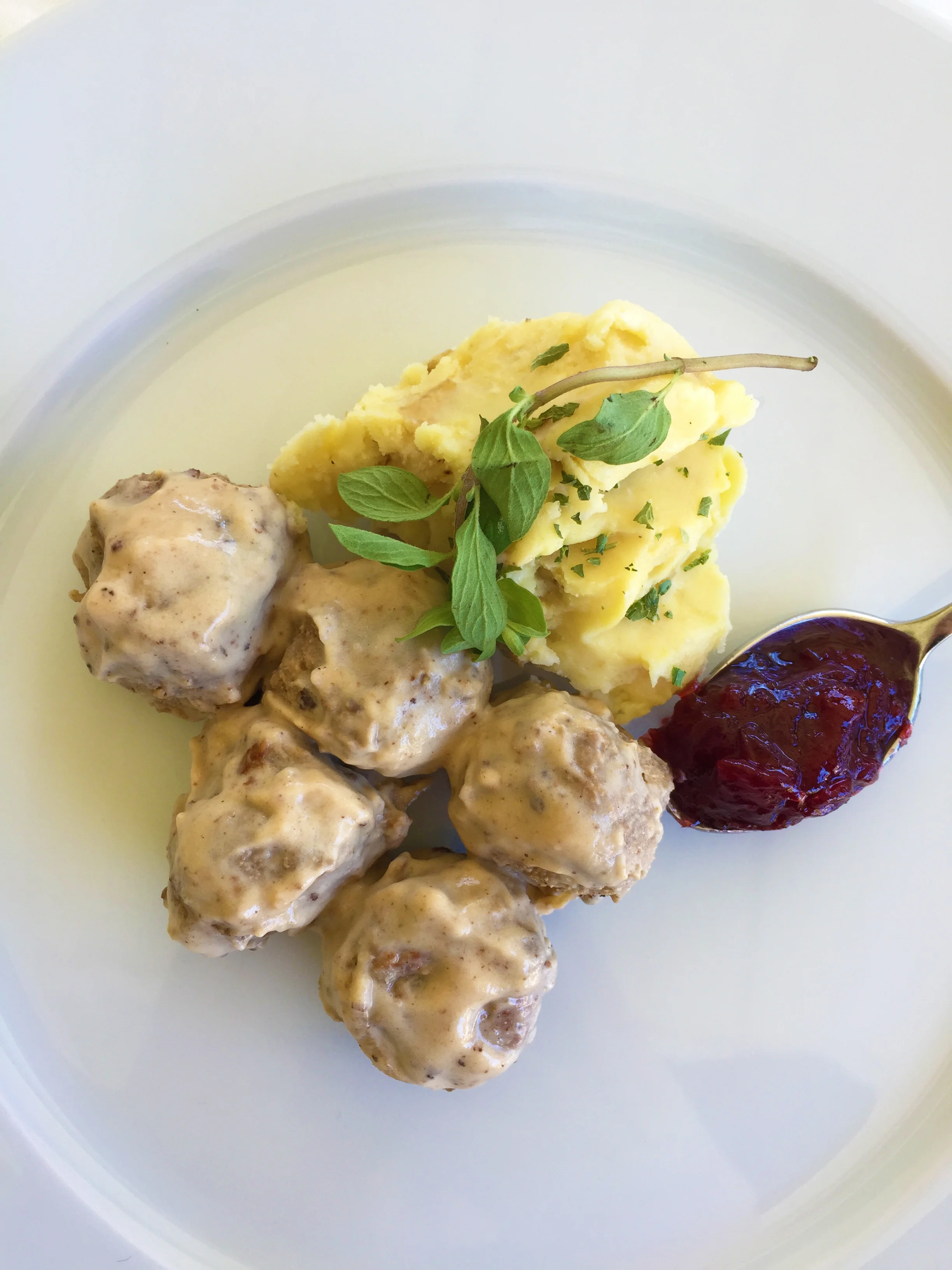 Traditional plating with mashed potatoes and lingonberries.