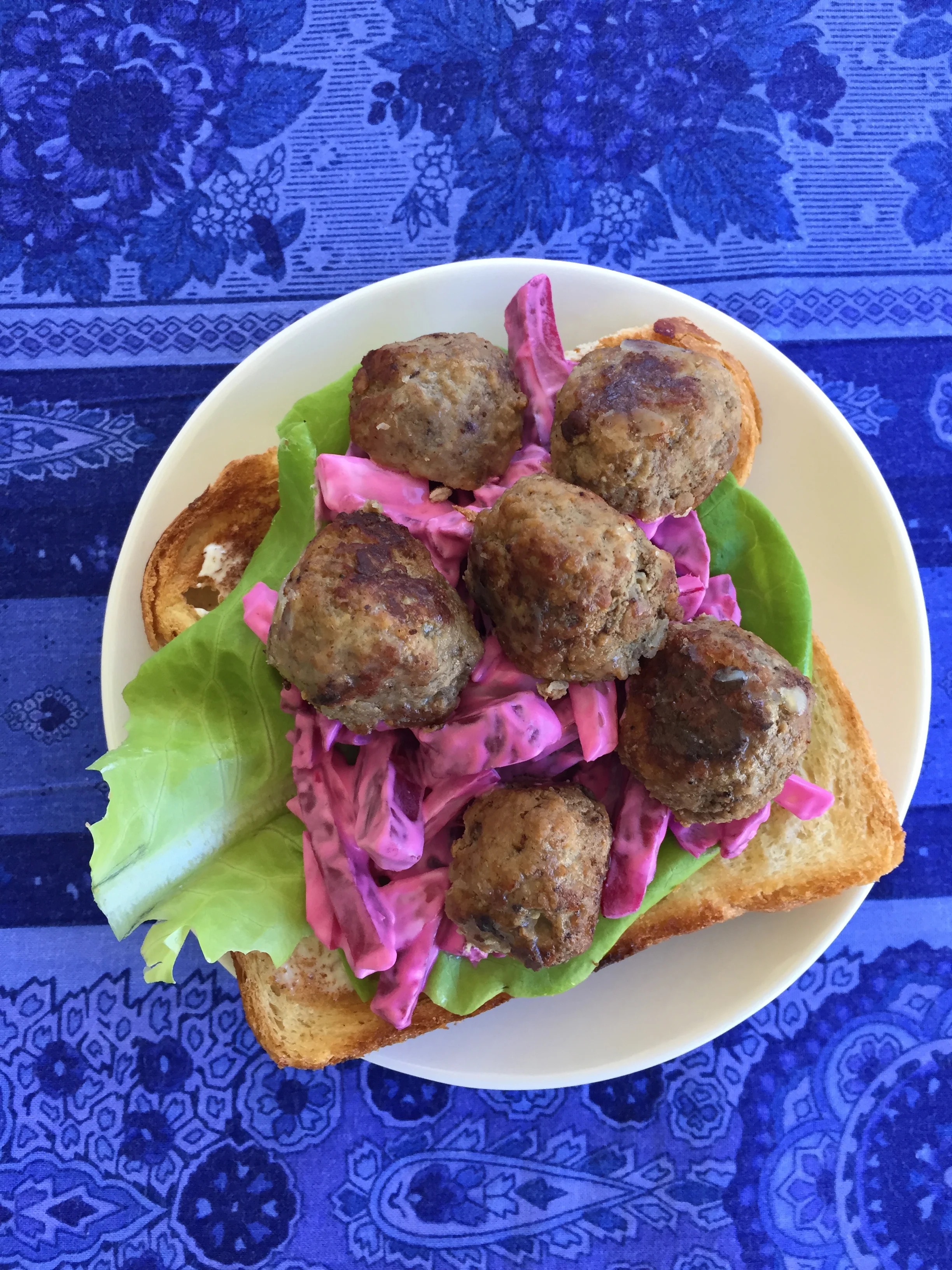 Open-faced sandwich with beet salad.