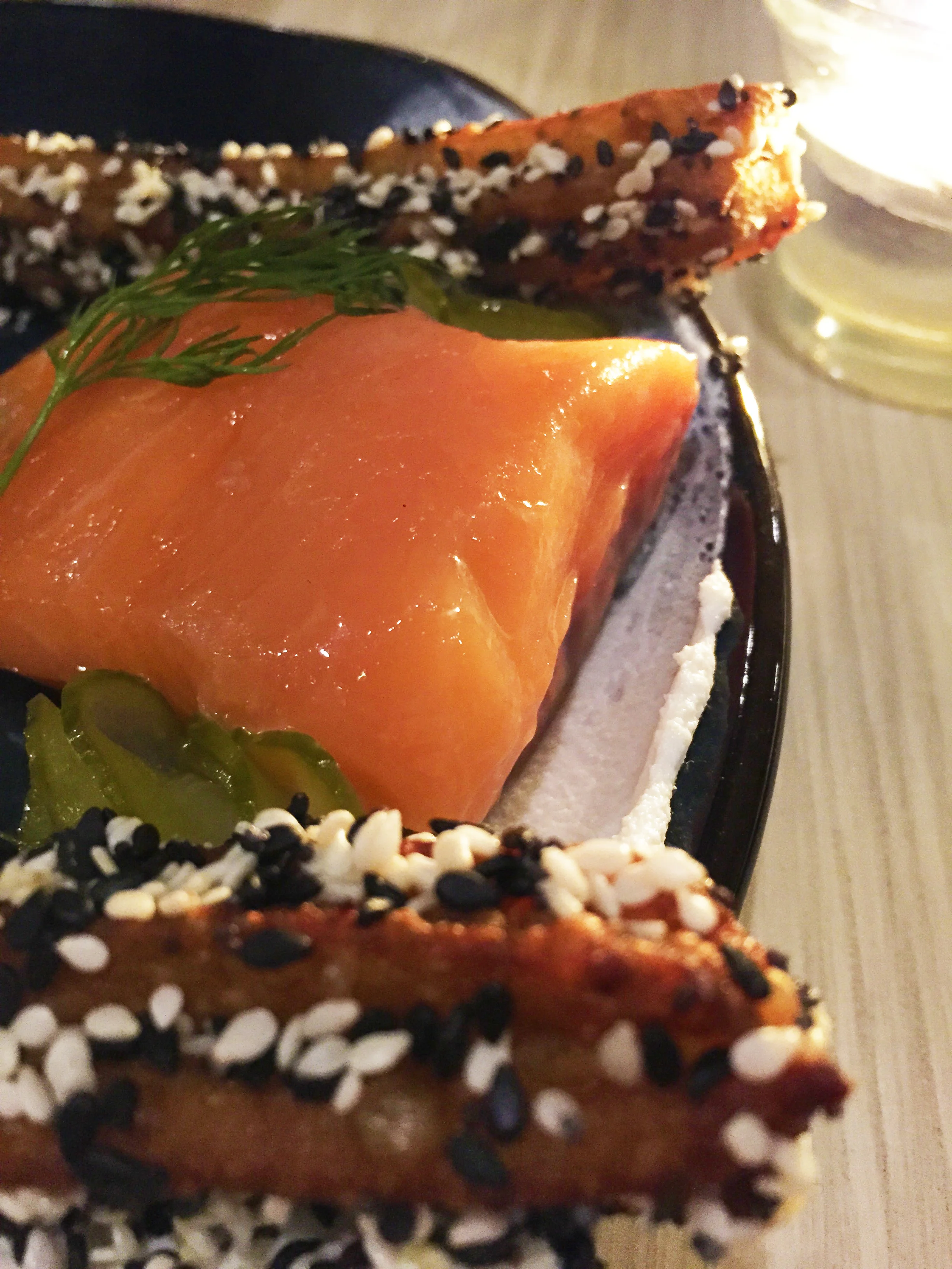 Juniper cured salmon with smoked goat cheese, pickle and everything bagel churro.