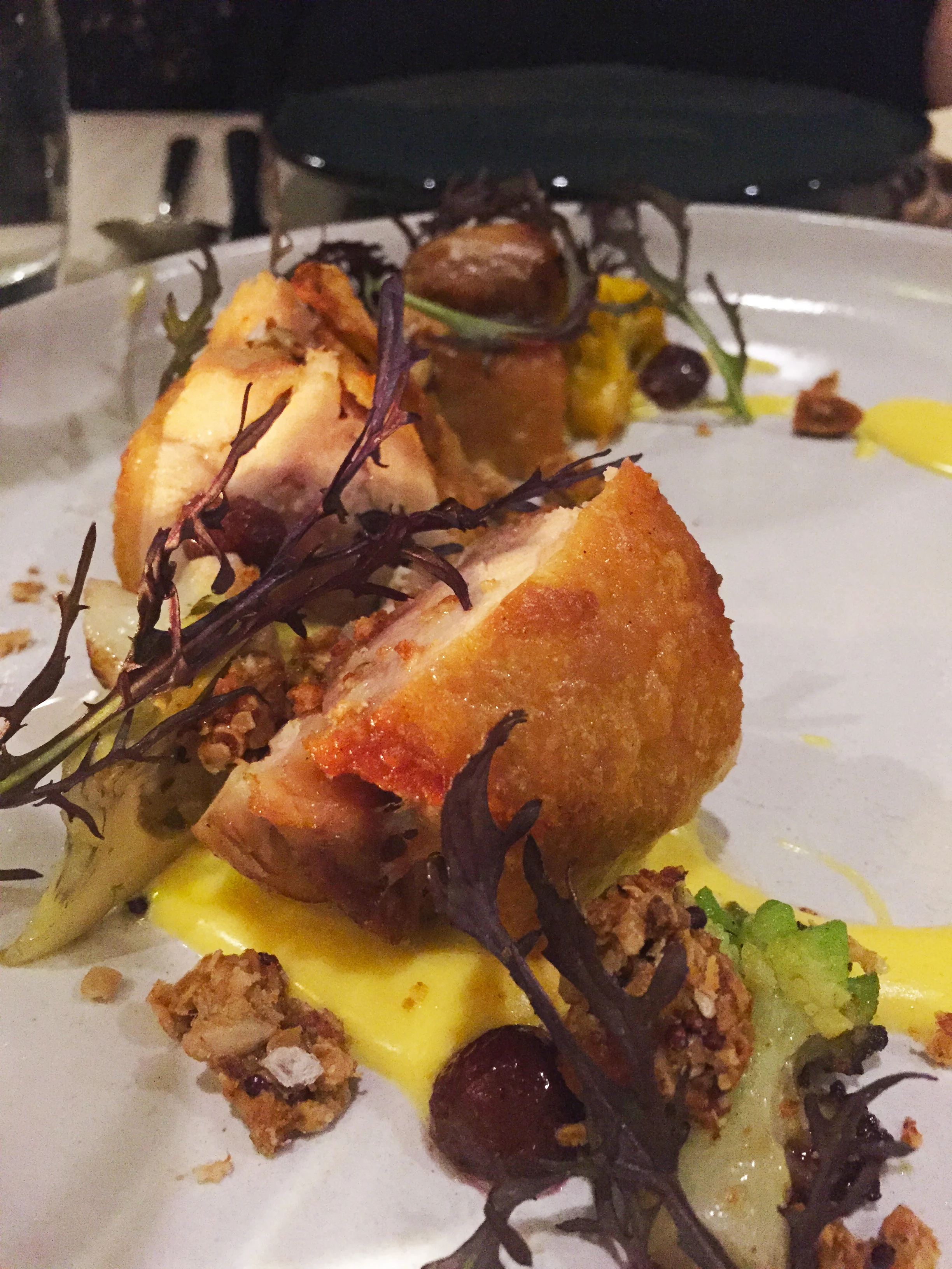 Chicken thigh with cauliflower, artichoke, chicken skin granola and brown butter hollandaise.