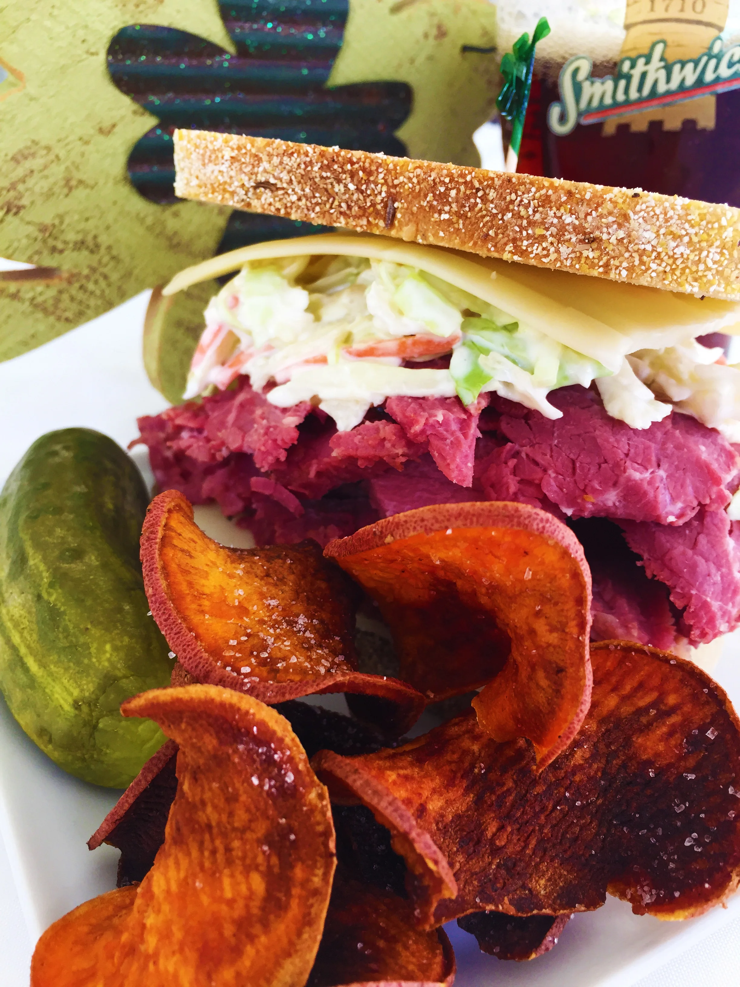 Cold corned beef on rye with cole slaw, Russian dressing, Swiss cheese, and quickly fried sweet potato slices.