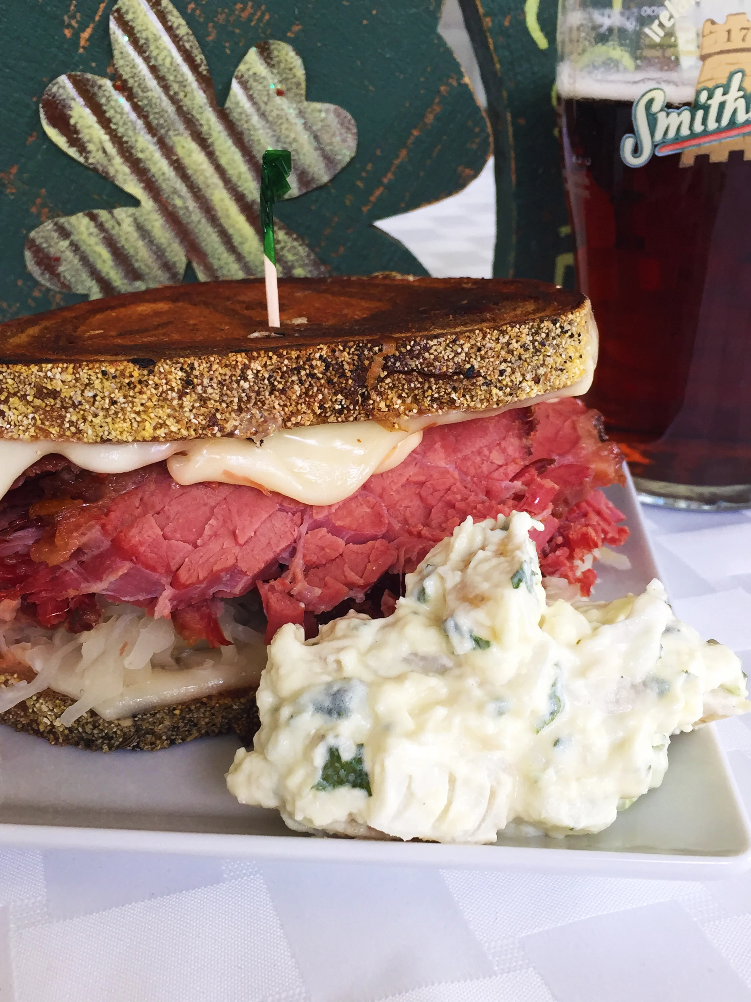 Corned Beef Reuben on marble rye with Russian dressing, Swiss cheese, and Boar's Head sauerkraut.