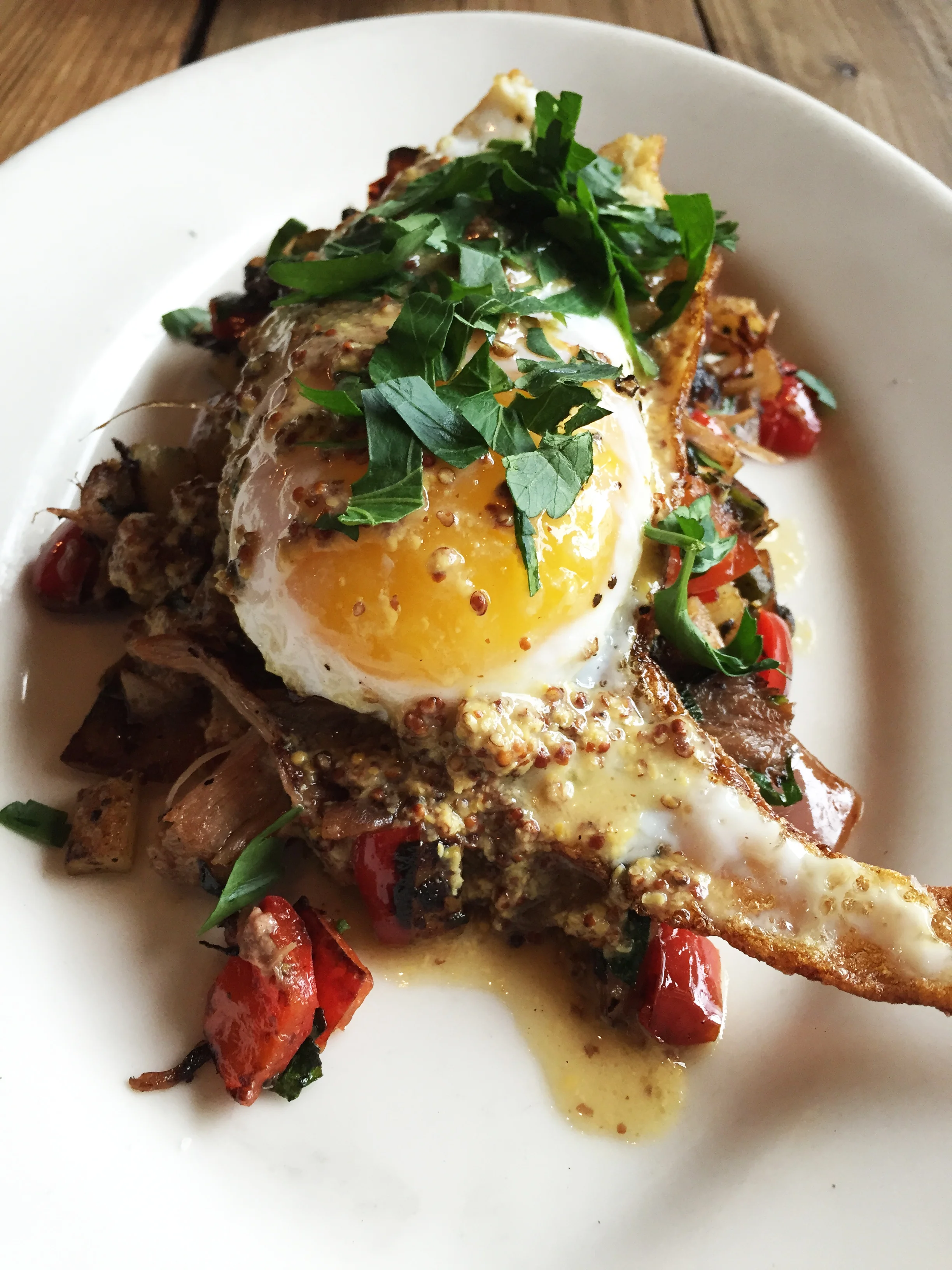 Sunny Side Duck Egg with Duck Confit Potato Hash and Grainy Mustard.