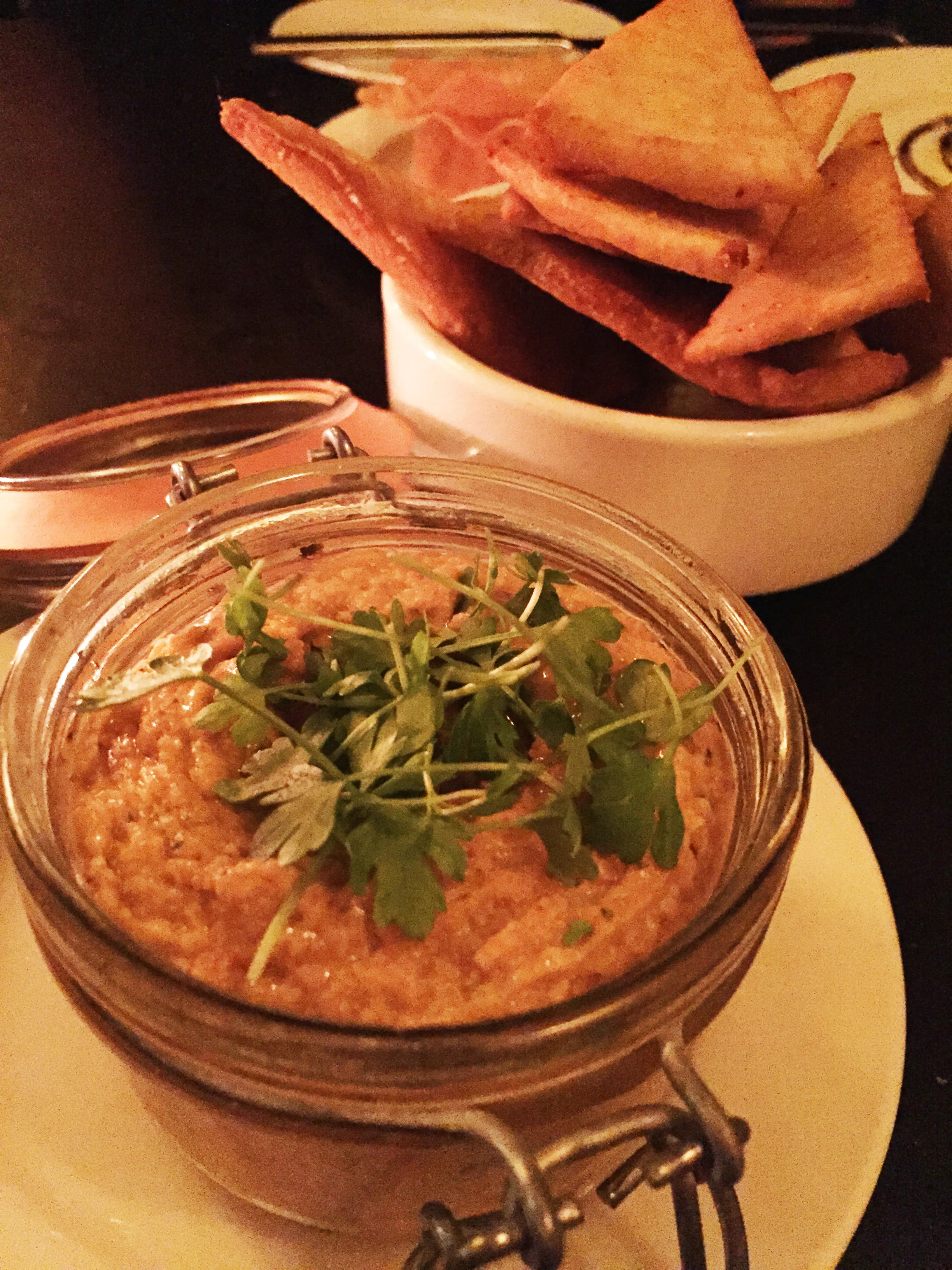 Chipotle Hummus with smoked paprika pita crisps.